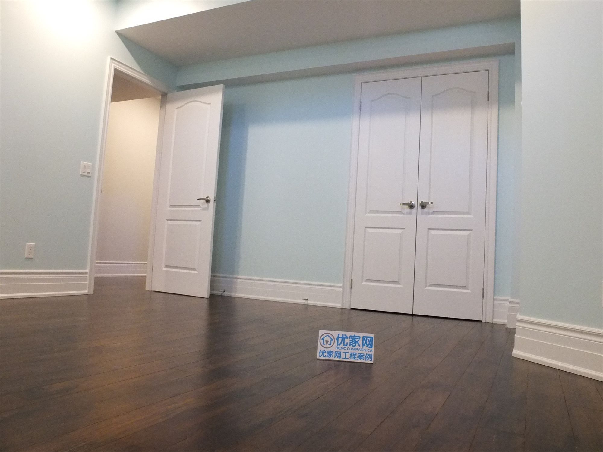 This Richmond Hill basement renovation features a finished bedroom with built-in closet storage, smooth wall finishes, and dark hardwood flooring. The space is designed for comfort and functionality, making it ideal for a guest room, home office, or rental basement unit.