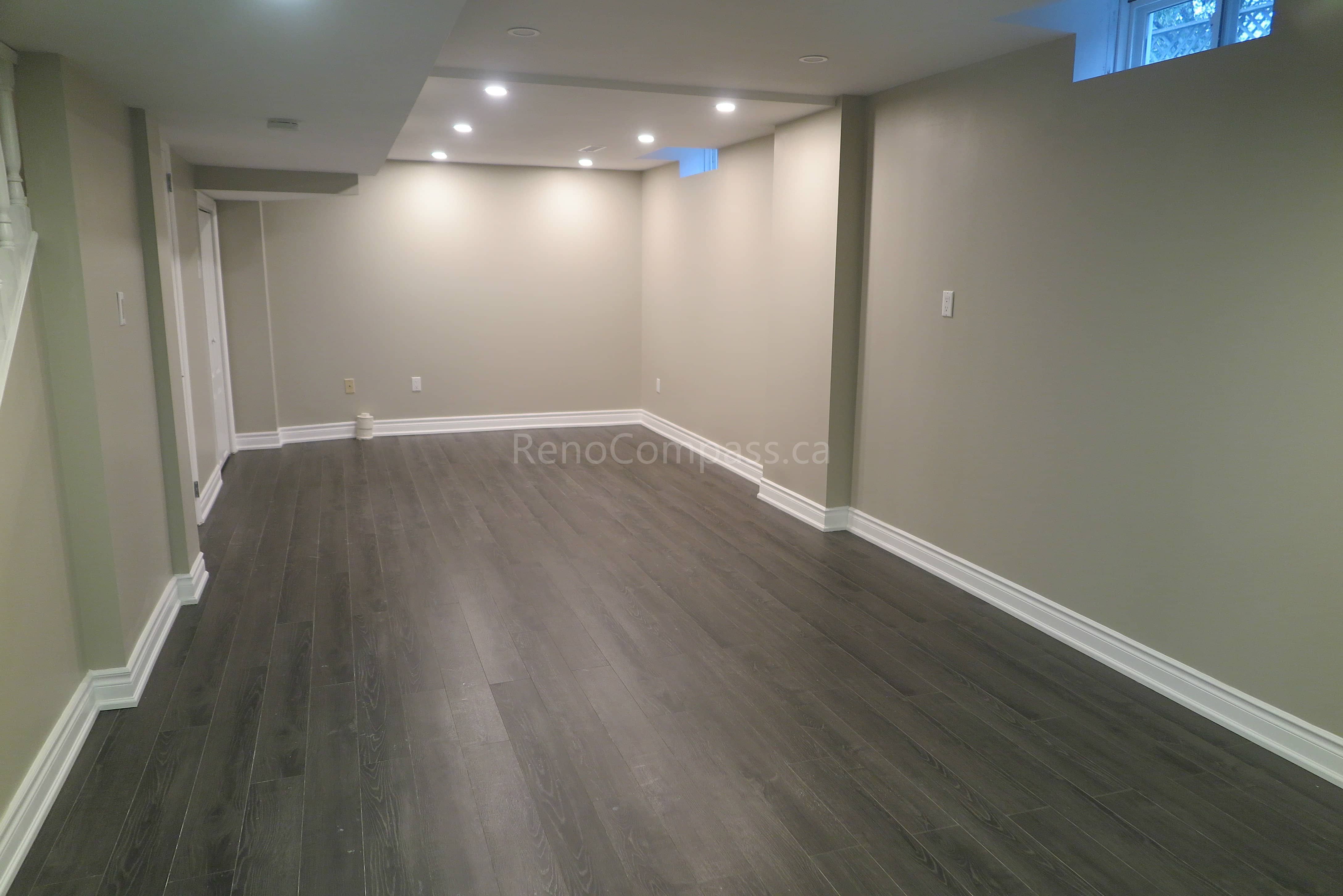 This Markham interior renovation highlights newly installed modern vinyl flooring with a natural wood-grain finish, designed for durability and contemporary style. The flooring enhances the open living space while complementing neutral wall tones, clean baseboard trim, and modern interior finishes. Completed by Reno Compass, a professional renovation contractor specializing in flooring installation and full interior renovations across Markham and the Greater Toronto Area.