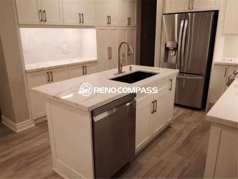 This modern kitchen renovation project in Mississauga features custom white shaker cabinets, quartz countertops, and a functional central island designed for everyday cooking and entertaining. Completed by a professional Toronto renovation company, the space combines clean cabinetry lines, upgraded lighting, and durable flooring to create a bright and highly functional kitchen environment. Stainless steel appliances, ample storage solutions, and a practical layout enhance both visual appeal and daily usability, delivering a timeless and elegant kitchen transformation for modern family living.