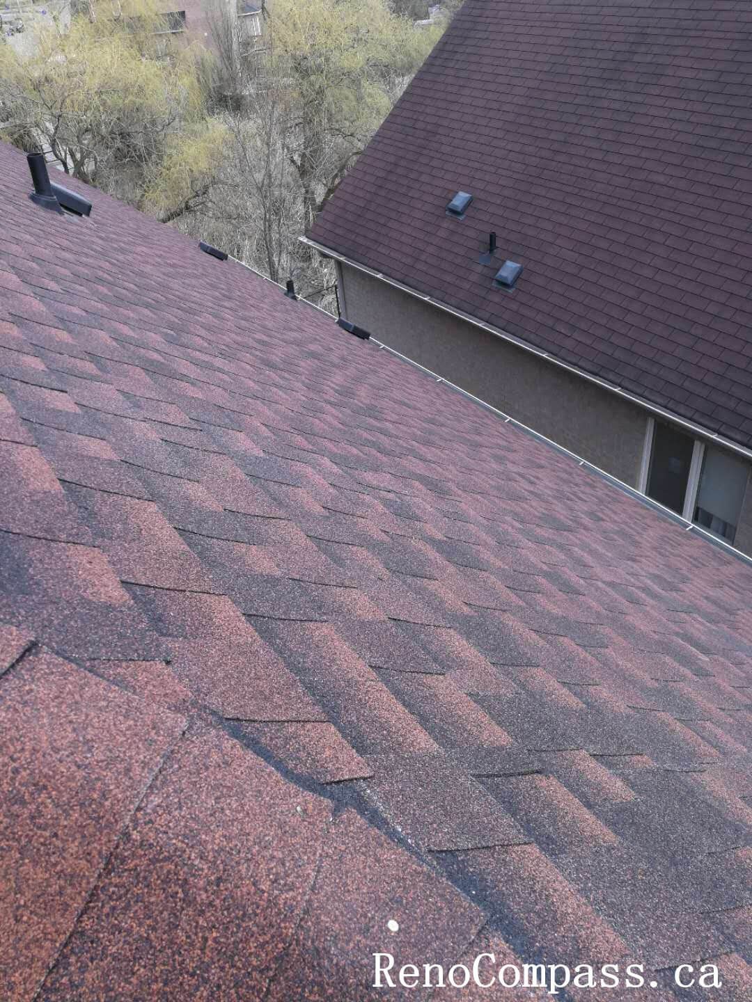 This image showcases the completed asphalt shingle installation during a roof renovation project in Richmond Hill. The shingles are precisely aligned and layered to ensure maximum waterproof performance and long-term durability. Completed by a professional Toronto roofing contractor, the upgraded roofing system enhances structural protection against snow accumulation, wind uplift, and heavy rainfall while improving overall exterior appearance.