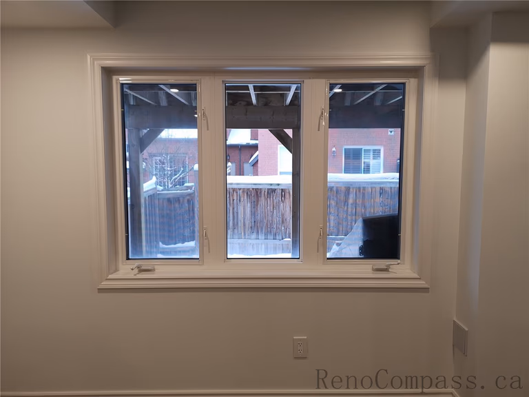 As part of this Richmond Hill basement renovation, new energy-efficient windows were installed to enhance natural light and improve insulation. The upgraded window frame and trim provide a clean, modern look while helping maintain indoor temperature and reduce energy loss. Completed by a trusted Toronto renovation company, Reno Compass Inc., this basement upgrade creates a brighter, more comfortable living space with improved functionality and long-term value.