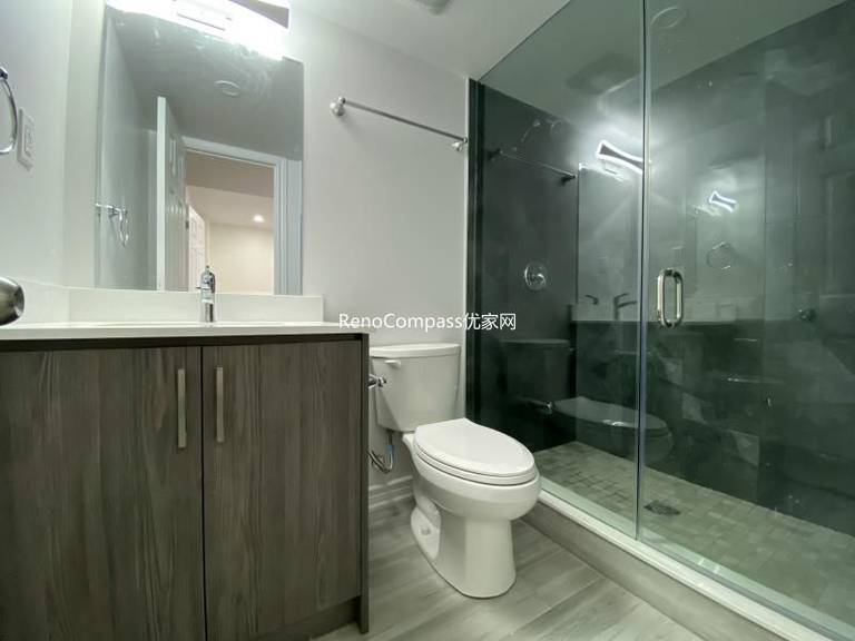 Modern basement bathroom renovation in Richmond Hill featuring a sleek glass shower enclosure, contemporary vanity, and upgraded tile finishes. Completed by a professional Toronto renovation company, this finished basement bathroom combines durability, functionality, and clean modern design to enhance comfort and everyday usability.