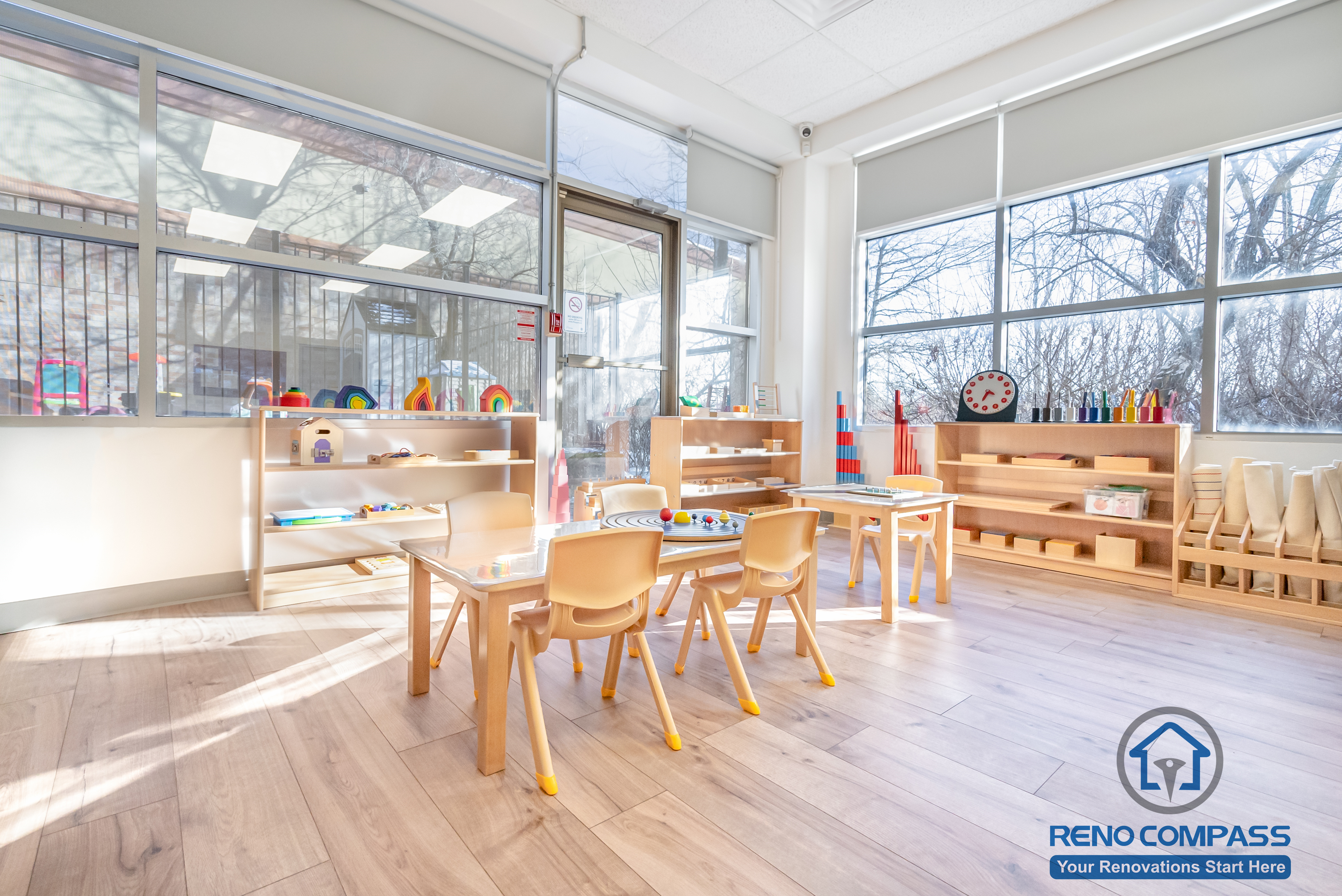 This Markham daycare renovation showcases a spacious classroom learning area designed to support group activities, early education, and daily routines. Child-sized tables and chairs are arranged to encourage collaboration while maintaining clear circulation for supervision. Open shelving and low-height cubbies provide organized storage that promotes independence and easy access for children. Durable, slip-resistant flooring and bright overhead lighting ensure safety, comfort, and long-term usability. Completed by a Toronto renovation company, Reno Compass Inc., this daycare interior renovation reflects a thoughtful balance of educational functionality, safety compliance, and efficient space planning for modern childcare environments.
