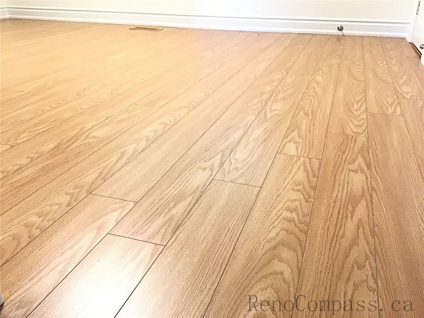 This close-up image showcases the fine craftsmanship of hardwood flooring installation in Oakville. The natural wood grain patterns, smooth surface finish, and precise plank alignment highlight the quality of materials and attention to detail, delivering a durable and visually refined flooring solution.