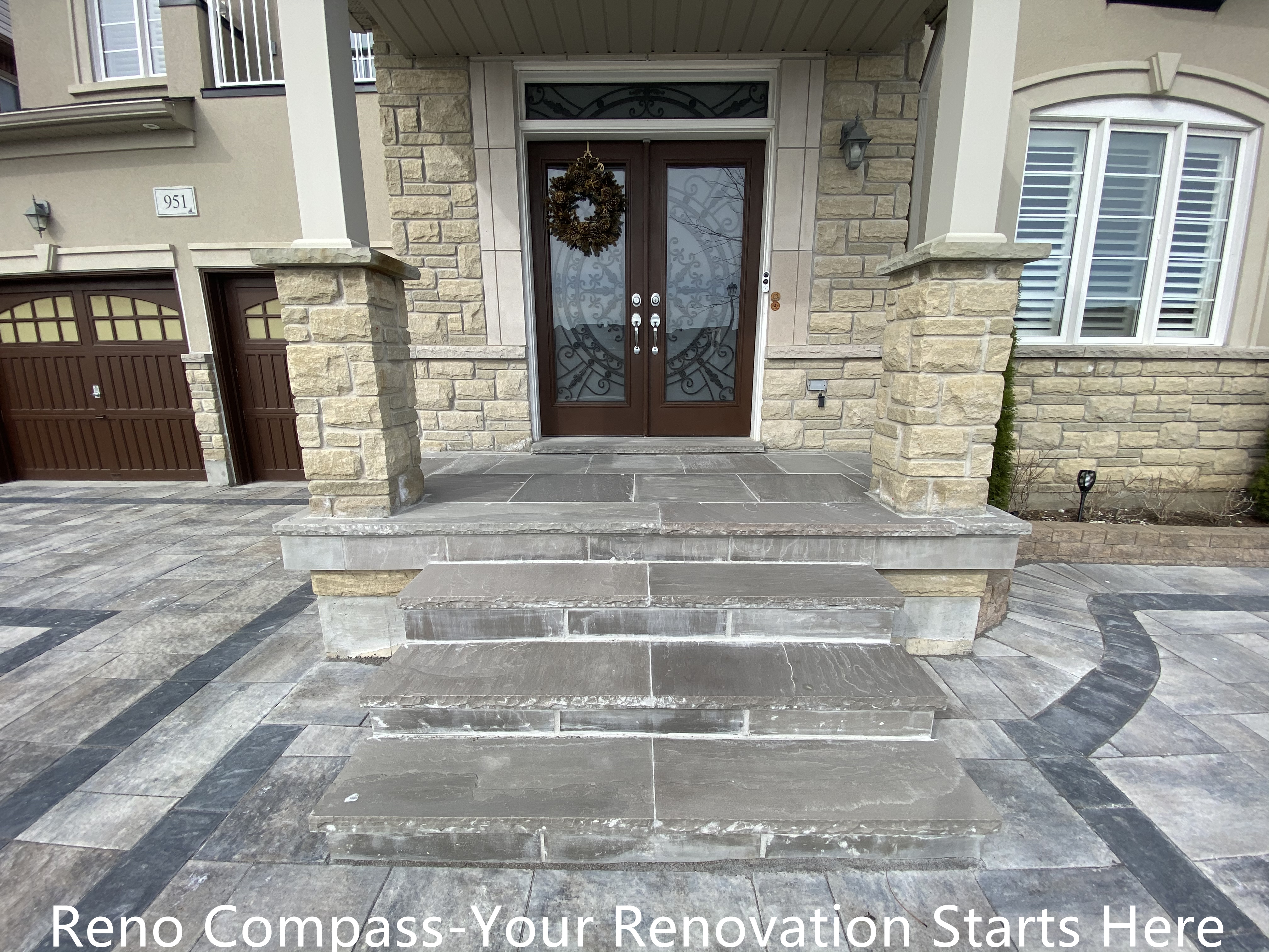 Front entrance interlocking steps renovation in Newmarket featuring large-format stone slabs, clean step alignment, and curved border detailing. The upgraded entryway enhances safety, durability, and visual impact while creating a welcoming transition from driveway to home entrance. Completed by a trusted Toronto renovation company specializing in high-quality exterior renovations.