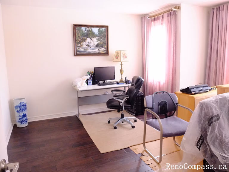 Toronto home hardwood flooring installation featuring deep-toned wood floors throughout the hallway and upper level. This professional flooring renovation enhances brightness, durability, and visual continuity, completed by Reno Compass for a clean and modern interior upgrade.
