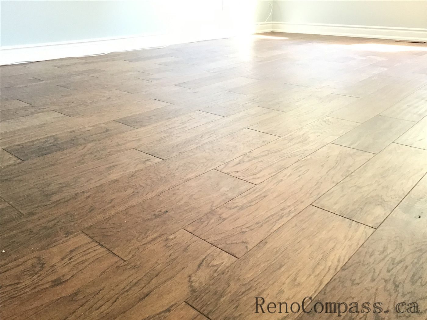 This image showcases high-quality natural wood flooring installed in a Richmond Hill interior renovation project. The warm tones and clean plank alignment highlight precise craftsmanship, durability, and a modern yet timeless design aesthetic.
