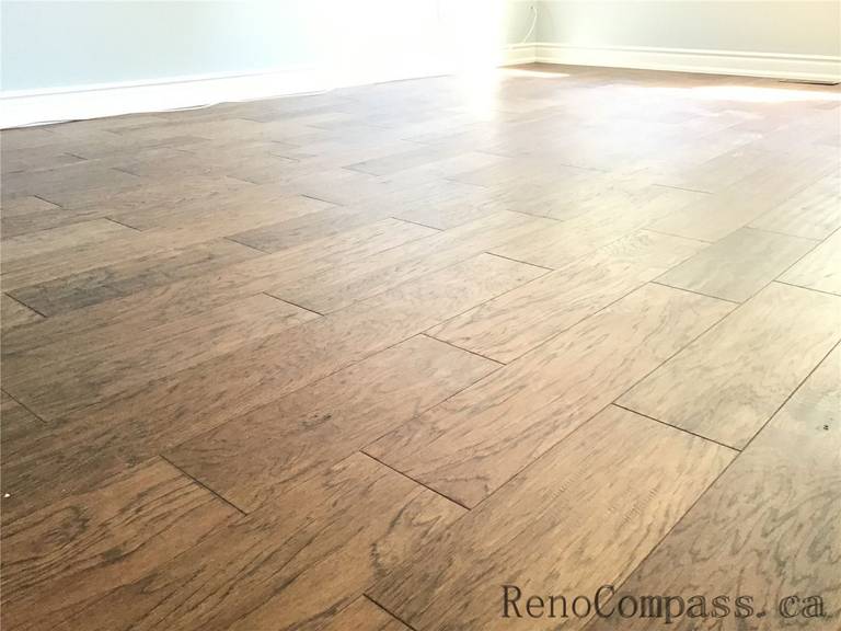 This image showcases high-quality natural wood flooring installed in a Richmond Hill interior renovation project. The warm tones and clean plank alignment highlight precise craftsmanship, durability, and a modern yet timeless design aesthetic.