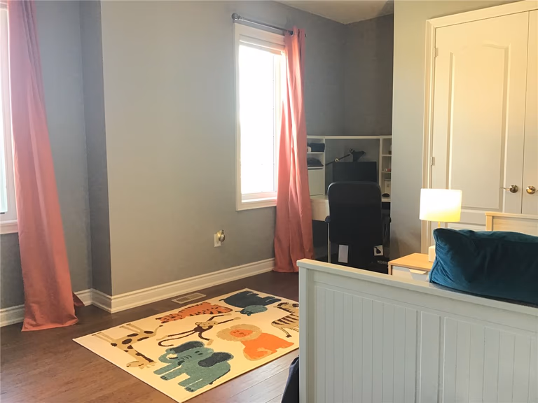 This Markham full home renovation features a bright and functional kids’ bedroom with hardwood flooring, large windows, and a flexible layout for study and play. The space combines comfort and practicality, making it ideal for growing families. Completed by a trusted Toronto Renovation Company, this design supports both daily living and long-term usability.