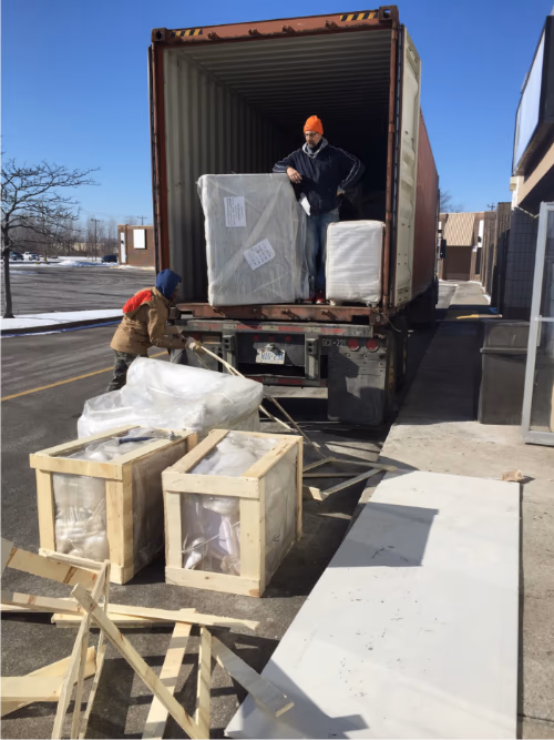 renovation project in Toronto. Large commercial fixtures and custom-built components are being unloaded from a shipping container, carefully prepared for interior installation.

The project involves coordinated logistics, material handling, and staged installation to ensure smooth construction progress. Deliveries like these typically include custom furniture, structural components, or entertainment-related equipment required for a high-end private club build-out.

Managed by an experienced Toronto renovation team, this large-scale commercial project demonstrates organized project planning, safe material handling, and professional construction workflow from delivery to final installation.