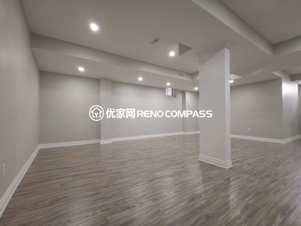 This Vaughan basement renovation features a fully finished open-concept layout designed for flexibility and modern living. The space includes new durable flooring, smooth ceiling finishing with pot lights, and clean structural column integration to create a bright and functional environment. Completed by a trusted Toronto renovation company, this basement transformation enhances usable living space while adding long-term comfort, value, and contemporary style to the home.