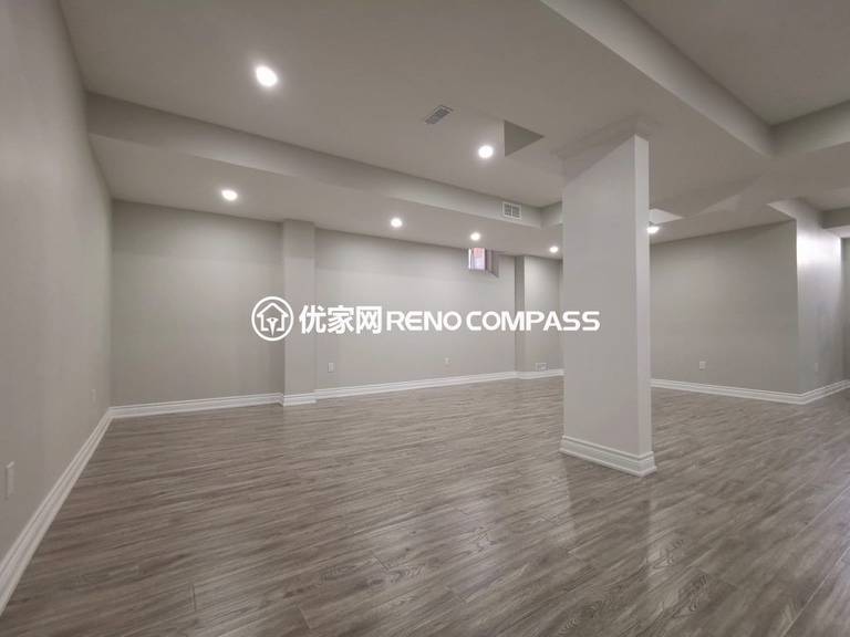 This Vaughan basement renovation features a fully finished open-concept layout designed for flexibility and modern living. The space includes new durable flooring, smooth ceiling finishing with pot lights, and clean structural column integration to create a bright and functional environment. Completed by a trusted Toronto renovation company, this basement transformation enhances usable living space while adding long-term comfort, value, and contemporary style to the home.