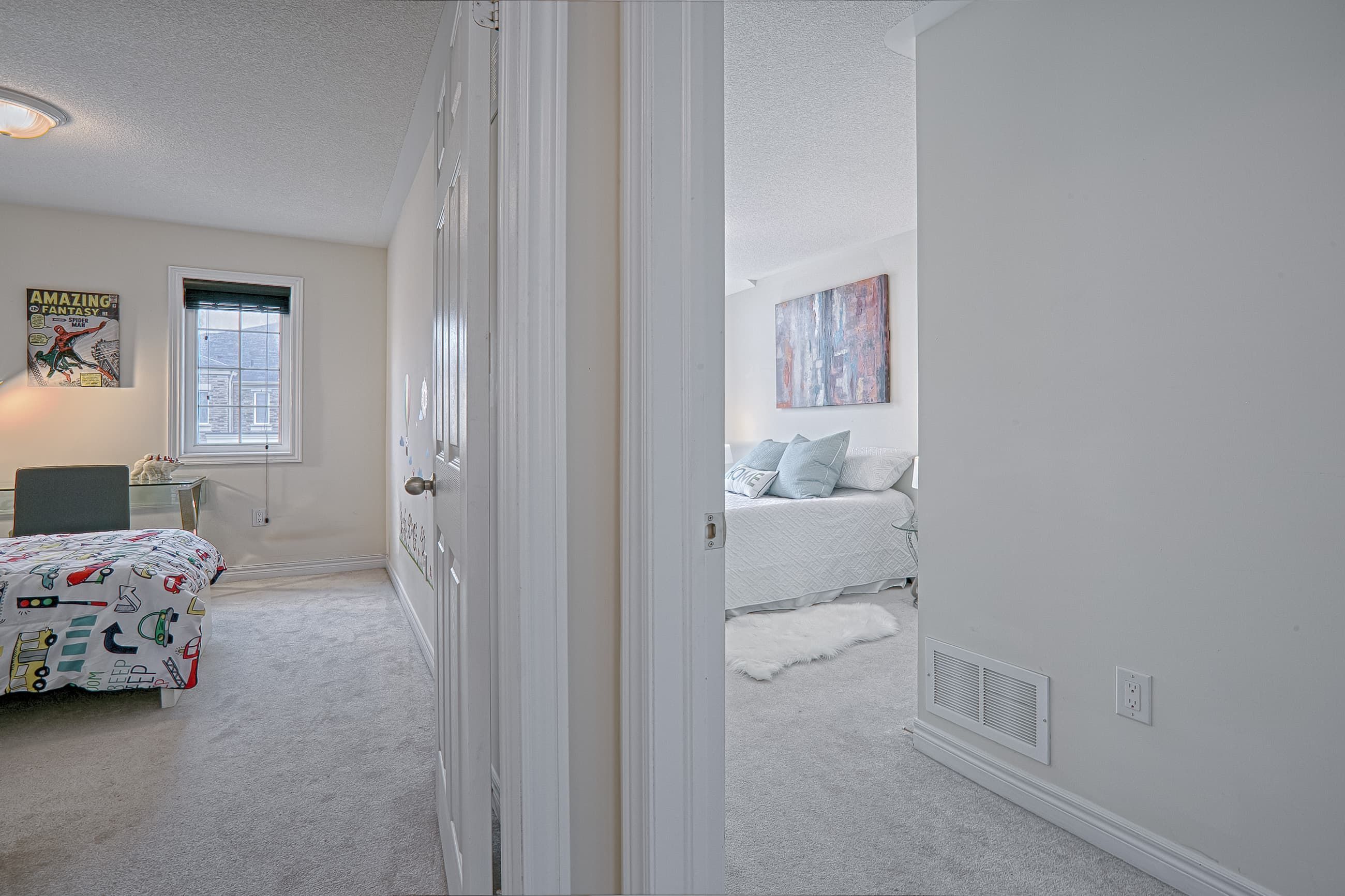 This modern master bedroom renovation showcases a calm and elegant design with soft neutral tones, plush carpeting, and large arched windows that bring in abundant natural light. The clean layout, cozy bedding, and contemporary bedside lighting create a relaxing and comfortable atmosphere ideal for everyday living. Completed by a professional Toronto renovation company, this bedroom upgrade highlights thoughtful space planning and refined interior finishes tailored for modern residential homes.