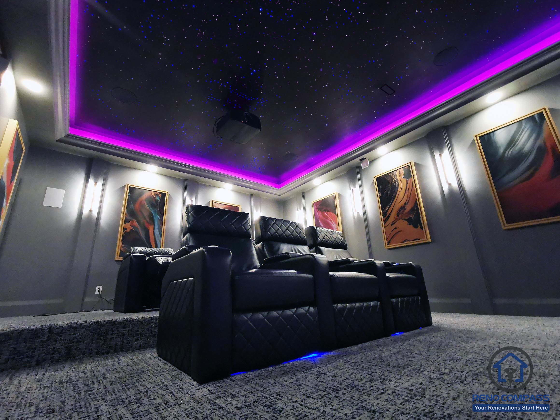 Full view of a custom home theatre renovation in Aurora featuring tiered seating, star ceiling, ambient LED lighting, and a large projection screen for immersive entertainment.