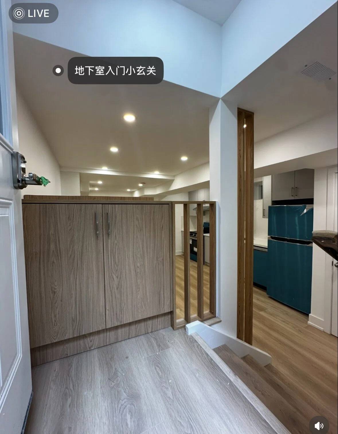 This basement entrance features a dedicated entryway in a Toronto legal 3-unit conversion project. The design creates a clear transition between outdoor access and the interior living space, enhancing privacy and functionality for rental use.