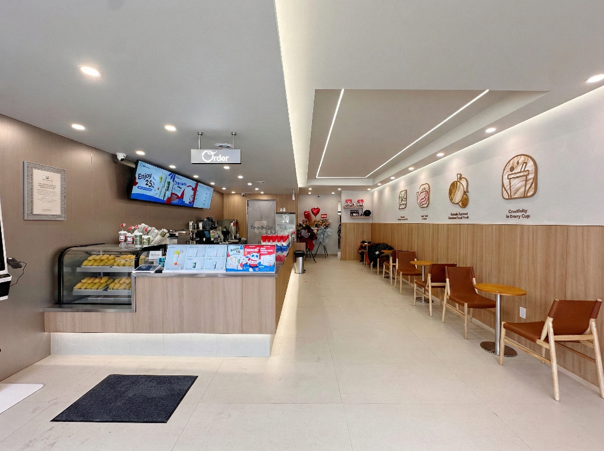 This North York bubble tea shop renovation showcases a clean and modern commercial interior with custom counter design, upgraded lighting system, and optimized customer seating layout. Completed by a professional Toronto renovation company, the project focuses on functionality, durability, and a bright welcoming atmosphere ideal for high-traffic beverage stores and trendy café environments.