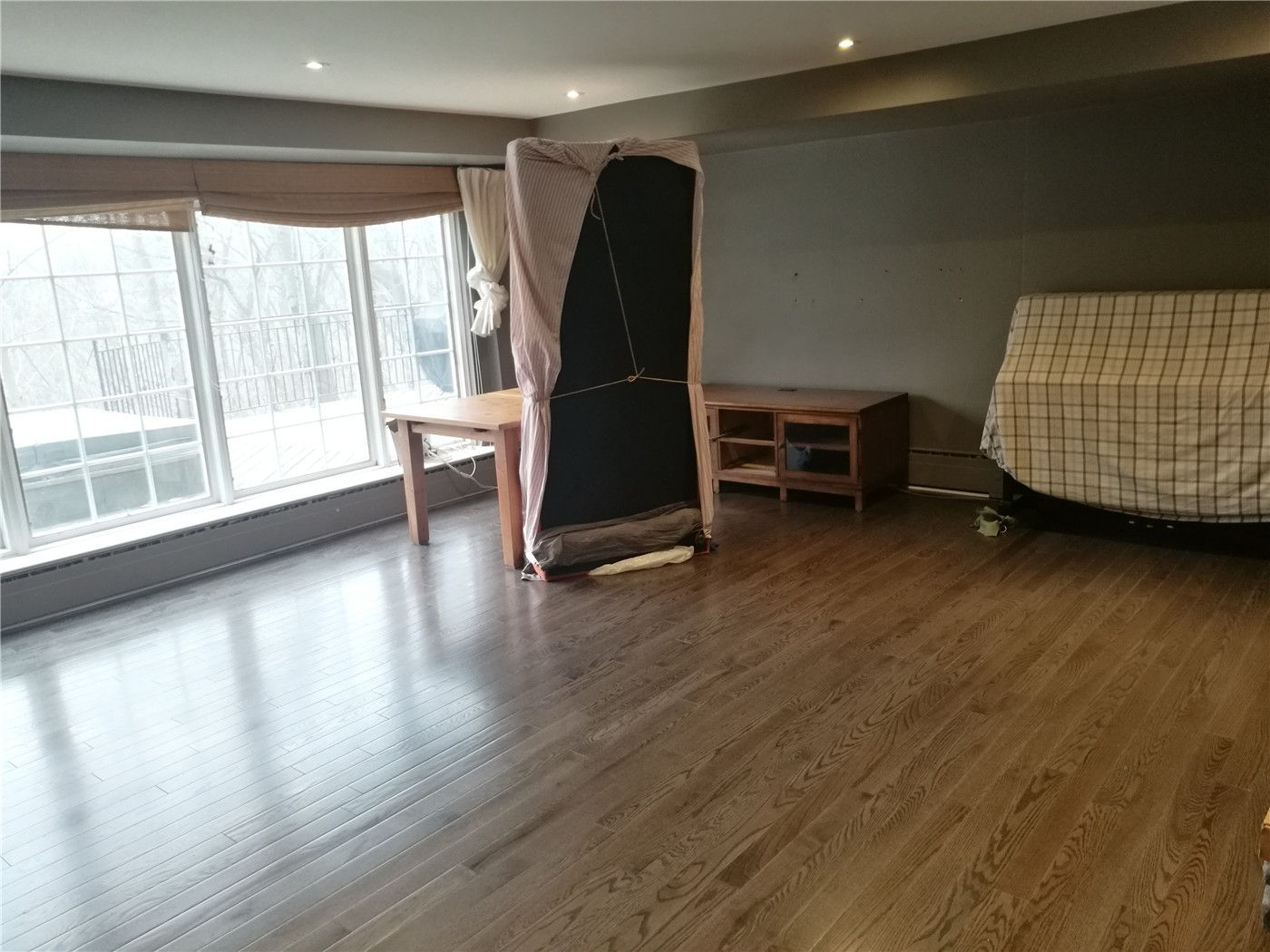 This Mississauga detached home flooring renovation features newly upgraded hardwood flooring that enhances warmth, durability, and overall interior value. Large windows bring in abundant natural light, highlighting the rich wood tones and clean installation lines. The project focuses on precise flooring installation, smooth transitions, and long-lasting performance suitable for everyday living. Completed by a professional Toronto renovation company, this flooring upgrade improves both comfort and visual appeal while creating a modern and refreshed interior space for the homeowners.