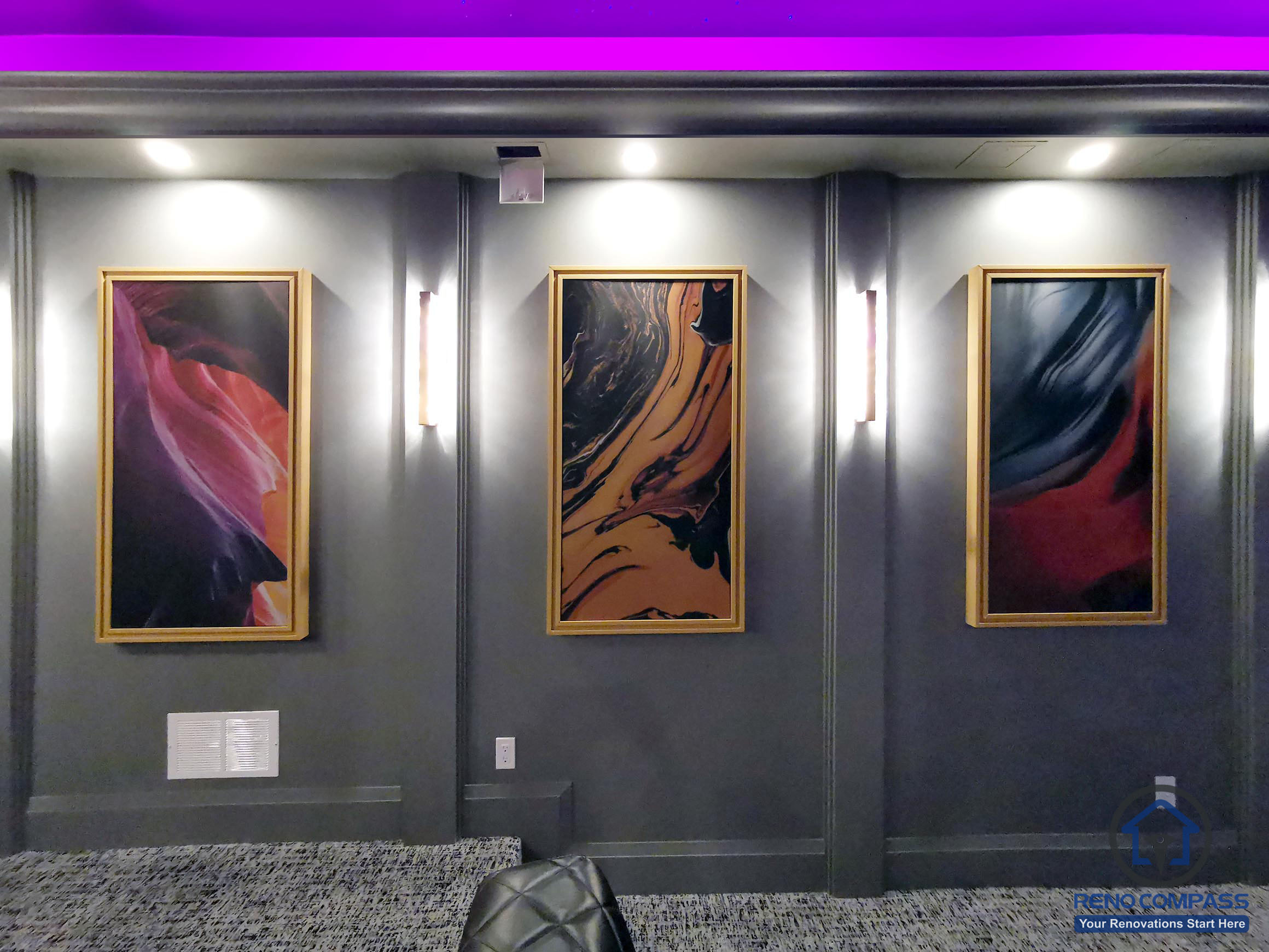 Accent wall detail in a home theatre renovation in Aurora featuring integrated wall lighting, custom paneling, and framed artwork to enhance the cinematic atmosphere