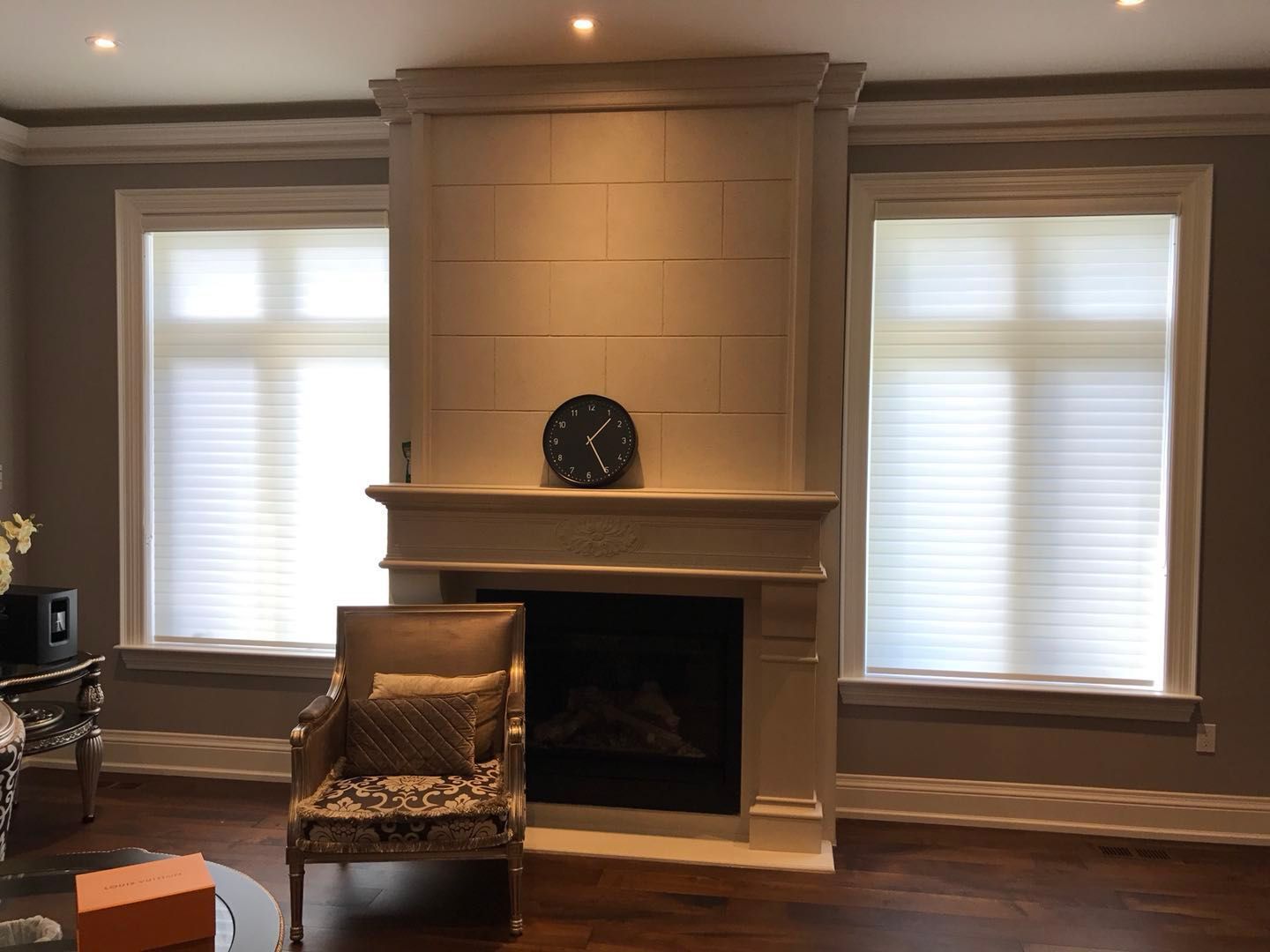 Custom zebra blinds installation in Toronto dining room by professional Toronto renovation company Reno Compass Inc. Featuring dual-layer light filtering shades, clean white window trim, modern chandelier lighting, and elegant wall panel detailing. This window treatment upgrade enhances privacy, natural light control, and interior aesthetics with a sleek and contemporary finish.