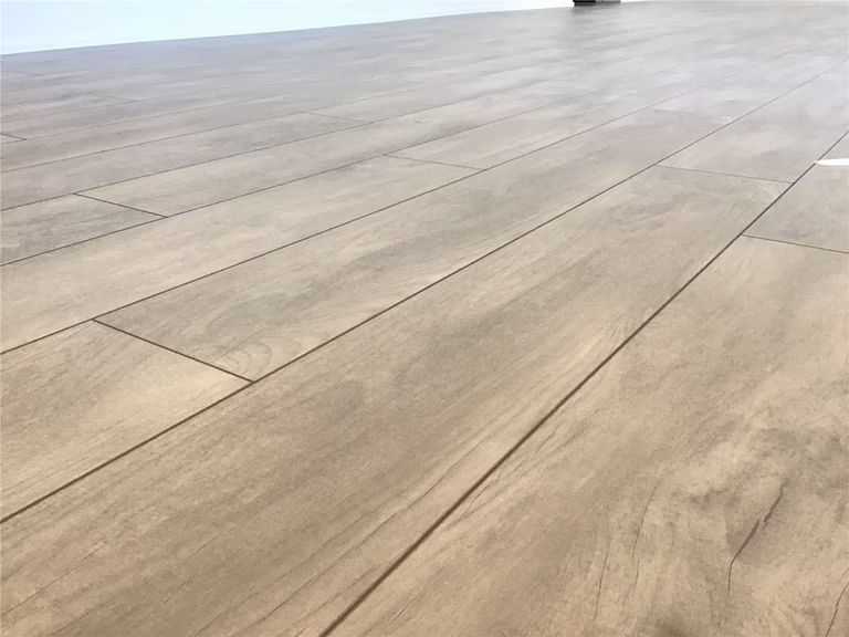 This Markham full home renovation highlights high-quality wood-look vinyl plank flooring with a natural grain texture and durable finish. The seamless installation enhances continuity throughout the space while providing long-lasting performance and easy maintenance. Completed by a trusted Toronto Renovation Company, this flooring solution combines aesthetic appeal with everyday practicality.