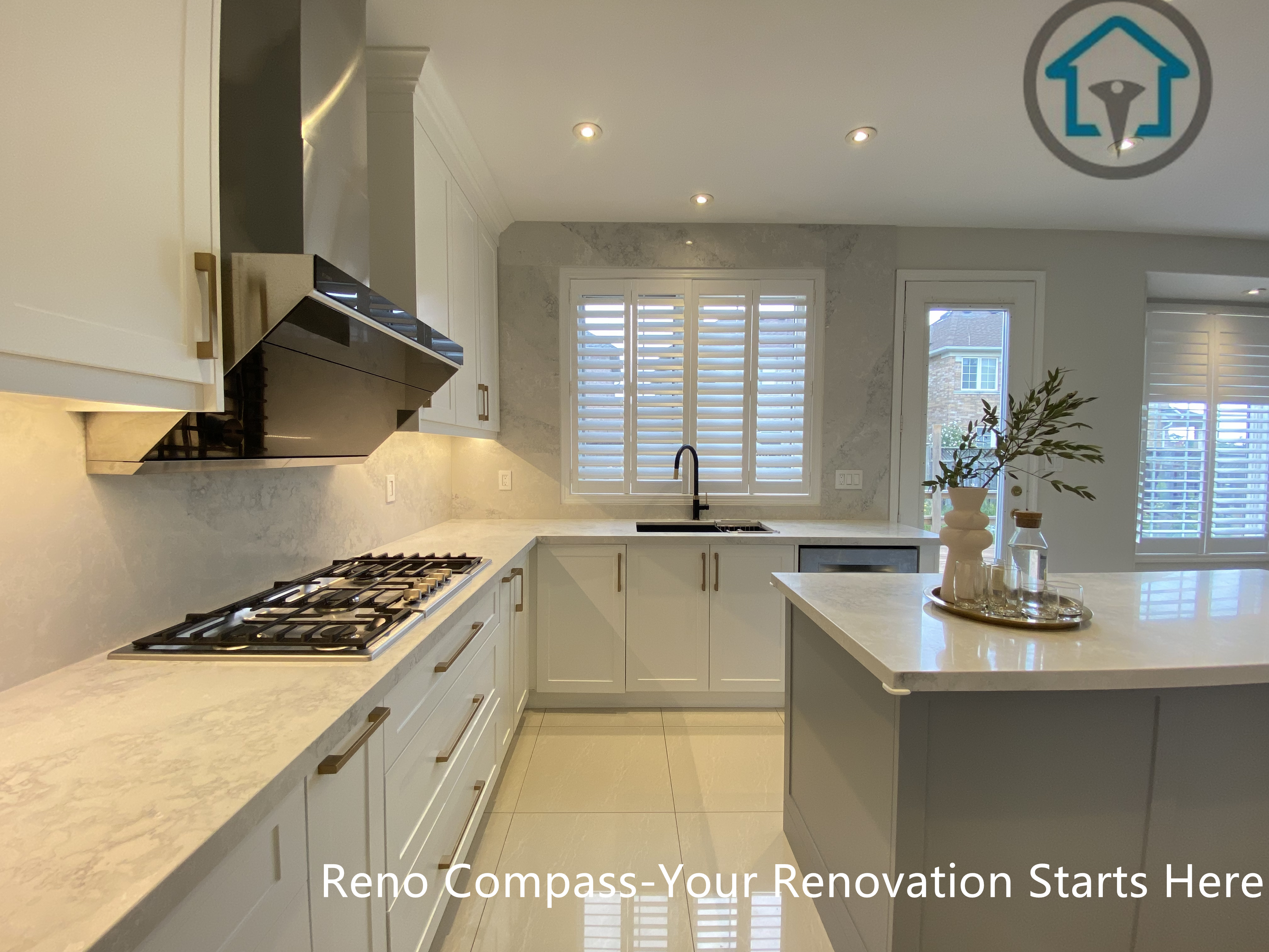 This image presents the functional work triangle of this Markham kitchen renovation, connecting the cooktop, sink, and central island in a clean, efficient layout. Custom cabinetry, a light stone countertop, and well-planned circulation create a kitchen that supports daily cooking while maintaining a calm, refined appearance. Completed by Reno Compass, this design reflects a practical and user-focused approach to modern kitchen renovation for homes in Markham.