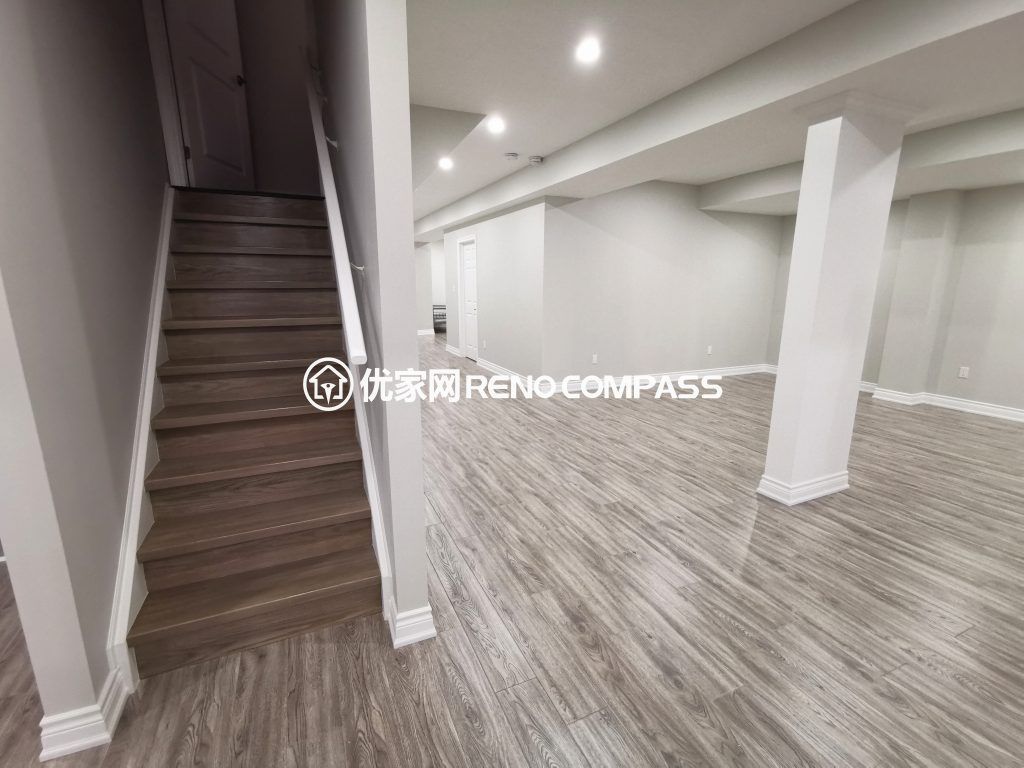 This Vaughan basement renovation showcases a newly finished open-concept layout with modern flooring, upgraded staircase finishing, and clean structural column detailing. The redesigned basement space offers a bright and spacious environment ideal for a recreation area, home office, or family entertainment zone. Completed by a professional Toronto renovation company, the project highlights quality craftsmanship, durable materials, and a contemporary design that enhances both functionality and property value.