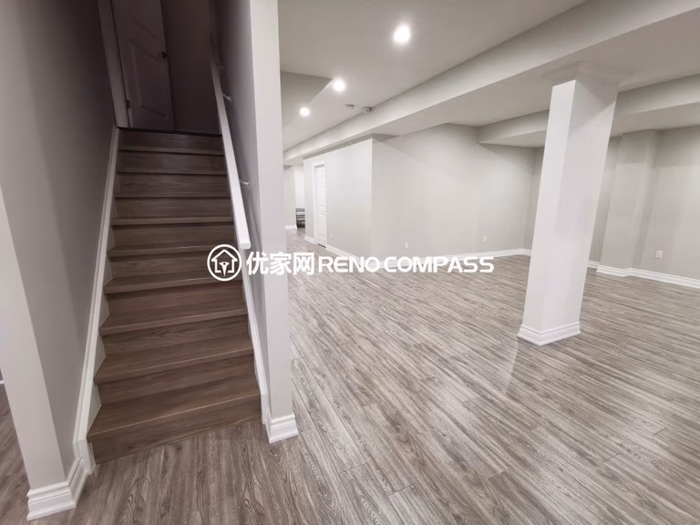 This Vaughan basement renovation showcases a newly finished open-concept layout with modern flooring, upgraded staircase finishing, and clean structural column detailing. The redesigned basement space offers a bright and spacious environment ideal for a recreation area, home office, or family entertainment zone. Completed by a professional Toronto renovation company, the project highlights quality craftsmanship, durable materials, and a contemporary design that enhances both functionality and property value.