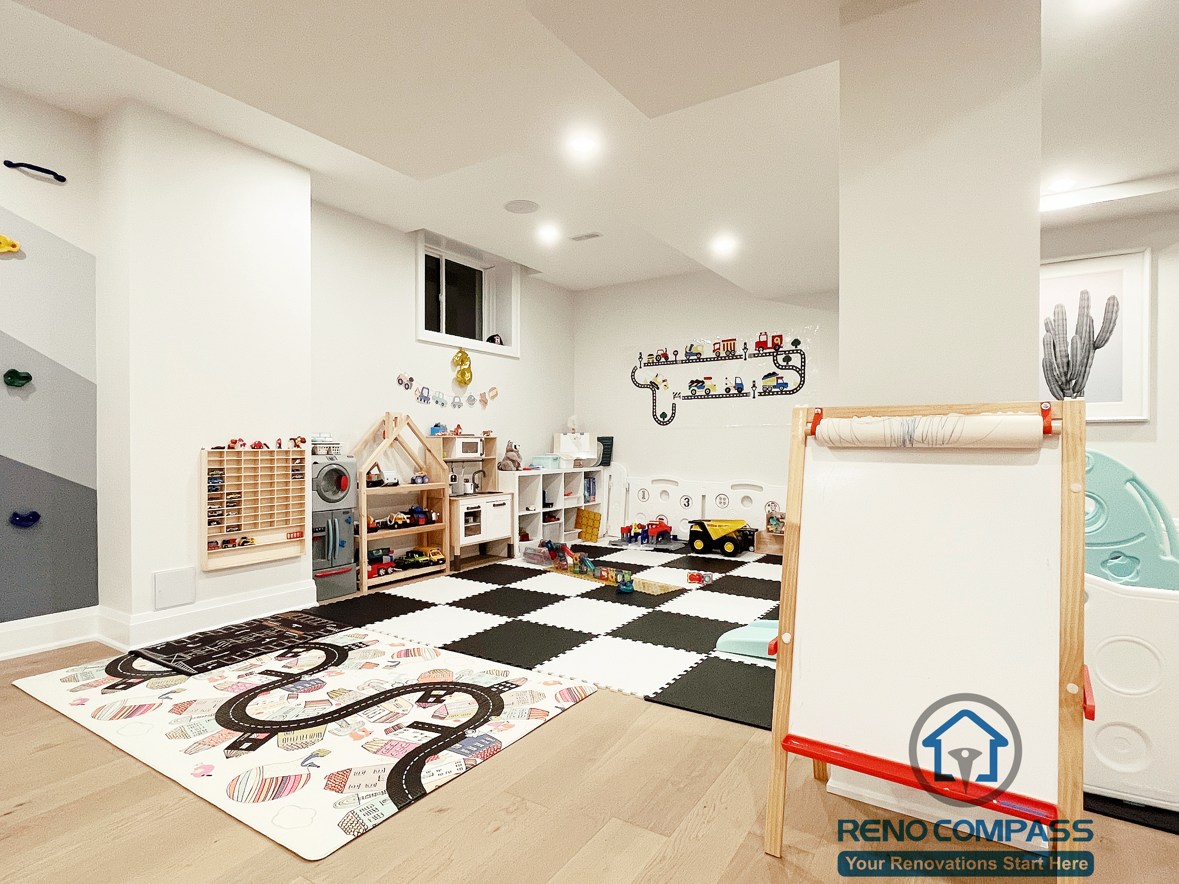 Basement playroom renovation in Newmarket featuring soft floor mats, built-in storage, bright lighting, and a safe open layout designed for children’s play and learning activities.