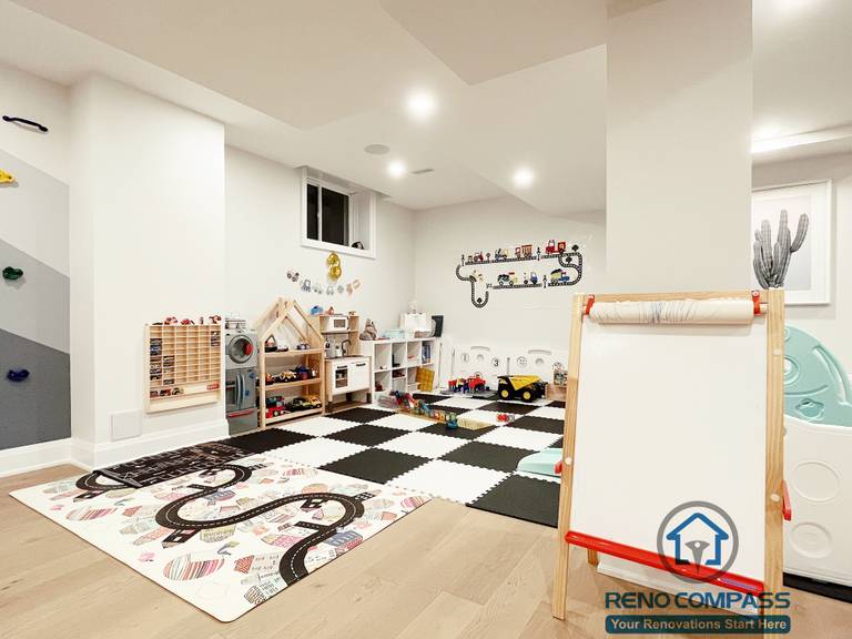 Basement playroom renovation in Newmarket featuring soft floor mats, built-in storage, bright lighting, and a safe open layout designed for children’s play and learning activities.