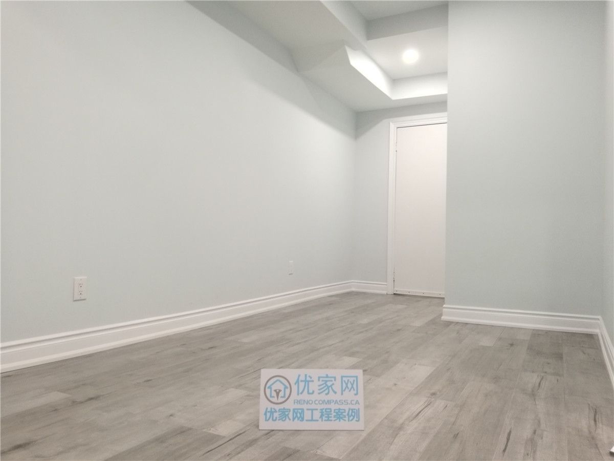This newly finished basement room in Vaughan features durable wood-look flooring, smooth neutral walls, and recessed ceiling lighting to create a clean and contemporary space. Completed by a professional Toronto renovation company, the basement upgrade enhances functionality and comfort, making it ideal for a guest room, home office, or additional living area.