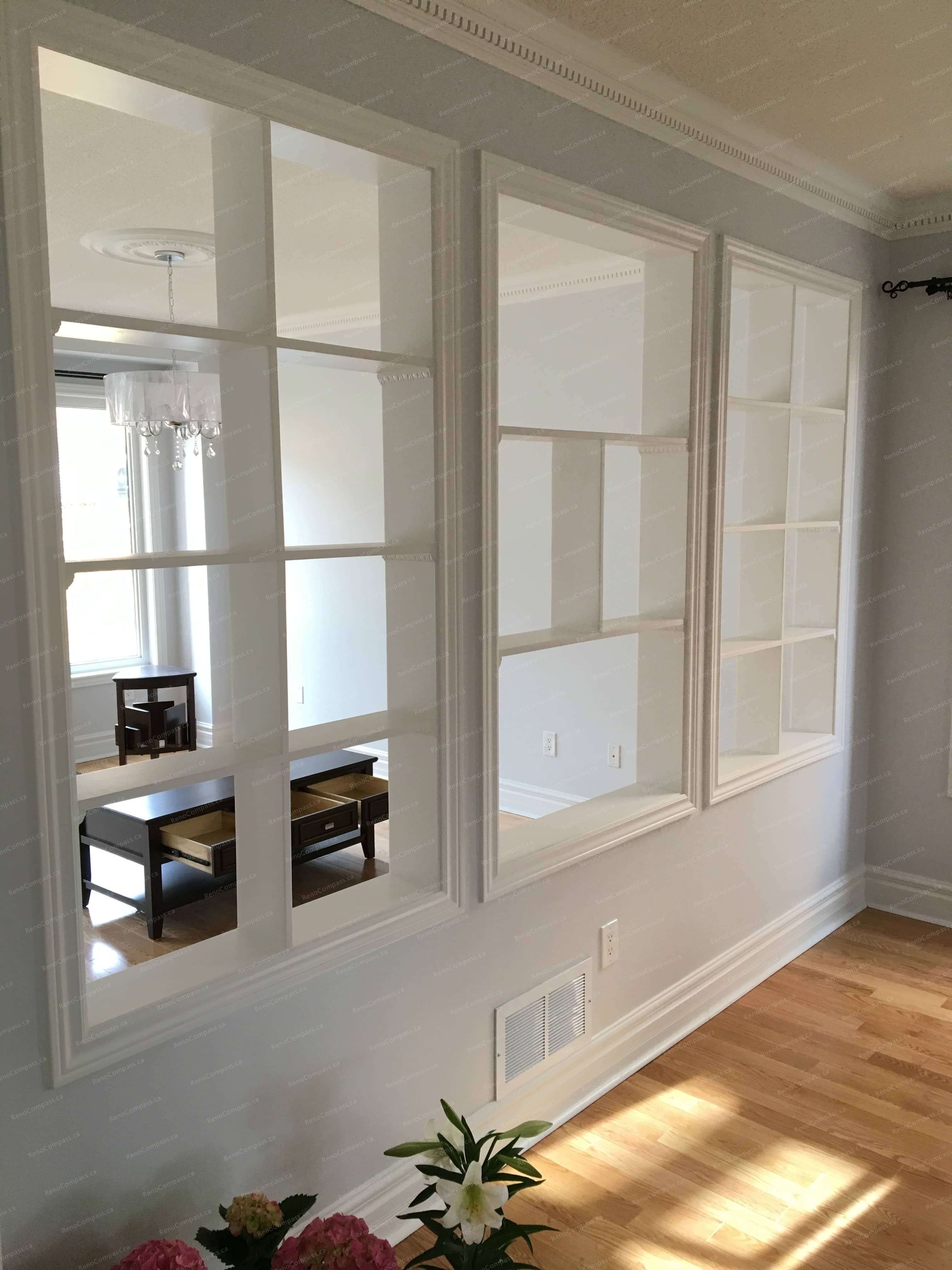 This Markham interior renovation features custom decorative interior windows that enhance natural light flow and create visual connection between living spaces. Paired with refined trim work and warm hardwood flooring, the design adds architectural character while maintaining a bright, open atmosphere. Completed by a professional Toronto renovation company, this upgrade improves both aesthetics and spatial continuity within the home.