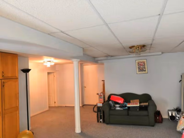 This basement renovation in Mississauga showcases an open-concept layout with structural support columns, upgraded lighting, and a clean, spacious design. The project focuses on improving functionality and preparing the basement for a modern living space transformation by a professional Toronto renovation company.