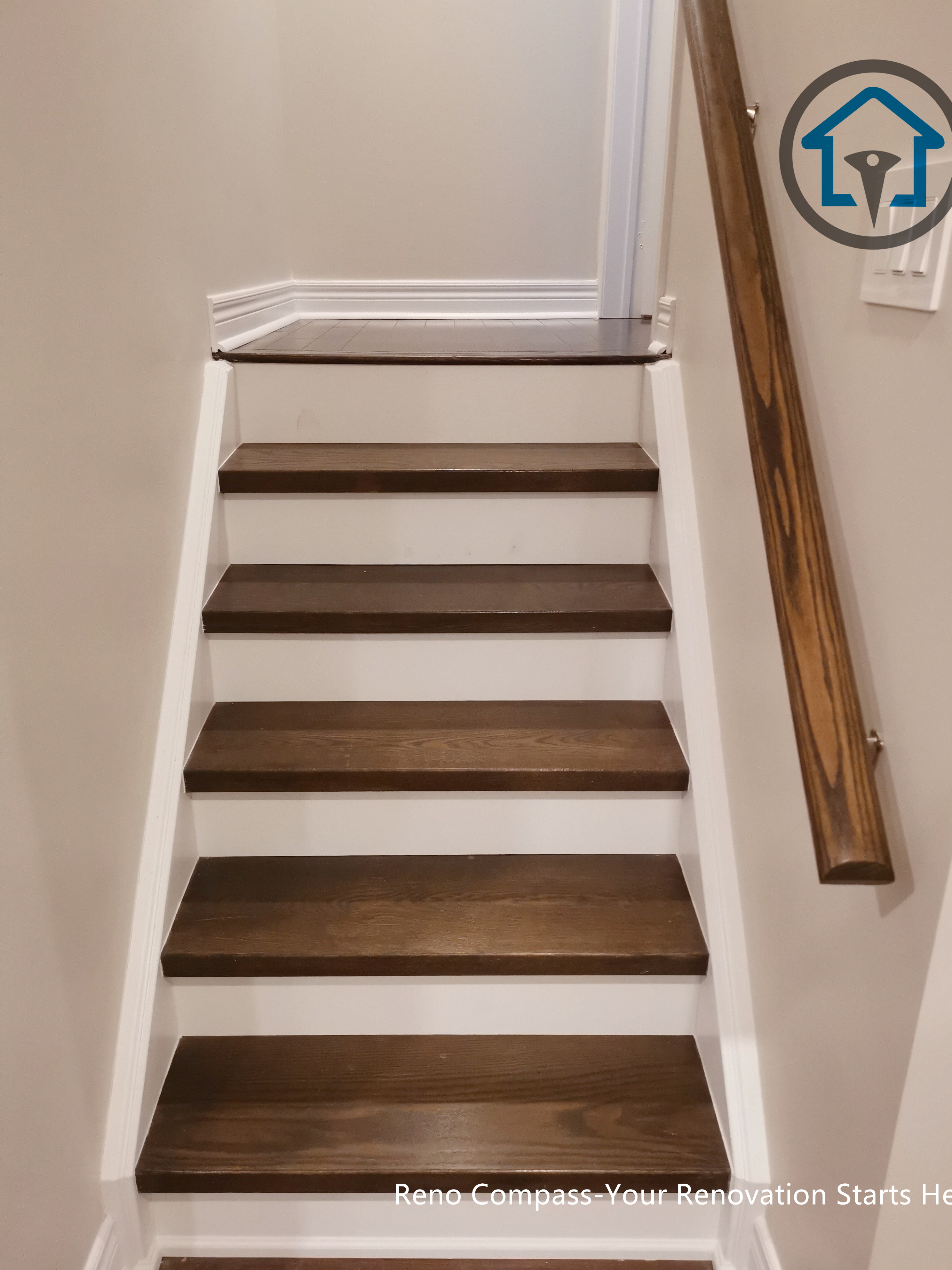 Basement staircase renovation in Markham with modern wood stair finishes, clean lines, and integrated design connecting basement and upper living areas.