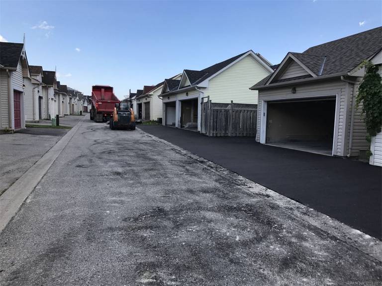 This Markham landscaping renovation includes newly paved asphalt driveways for residential garage access, creating a smooth and durable surface for everyday use. The fresh paving improves curb appeal while enhancing the functionality and safety of the property. Completed by a professional Toronto Renovation Company, the project ensures long-lasting performance with clean and precise asphalt installation.