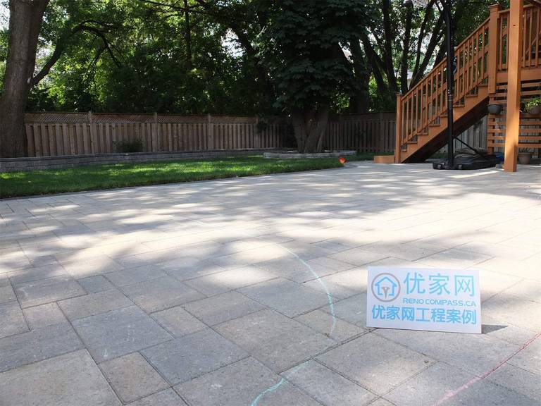 This North York landscaping renovation features a spacious backyard interlocking patio designed for durability and everyday outdoor use. Large-format pavers were installed with precise alignment to create a clean, level surface suitable for seating, circulation, and connection to the raised deck. The patio layout integrates seamlessly with the surrounding lawn, retaining walls, and mature trees, ensuring proper drainage, structural stability, and long-term performance. This project demonstrates a balanced hardscape solution that enhances backyard functionality while maintaining a refined residential landscape in North York.