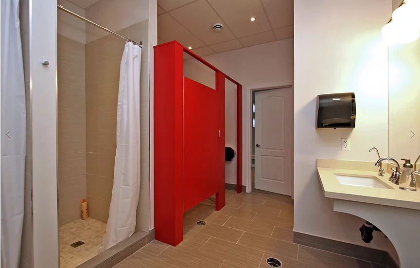 Upgraded change room and shower area completed for a Richmond Hill yoga studio commercial renovation. This project features new tiled shower installation, modern wash station, durable flooring, and privacy partition upgrades designed for wellness and fitness environments. The renovation improves functionality, cleanliness, and user comfort while meeting commercial building standards. Completed by a trusted Toronto renovation company specializing in gym, yoga studio, and commercial interior renovations.