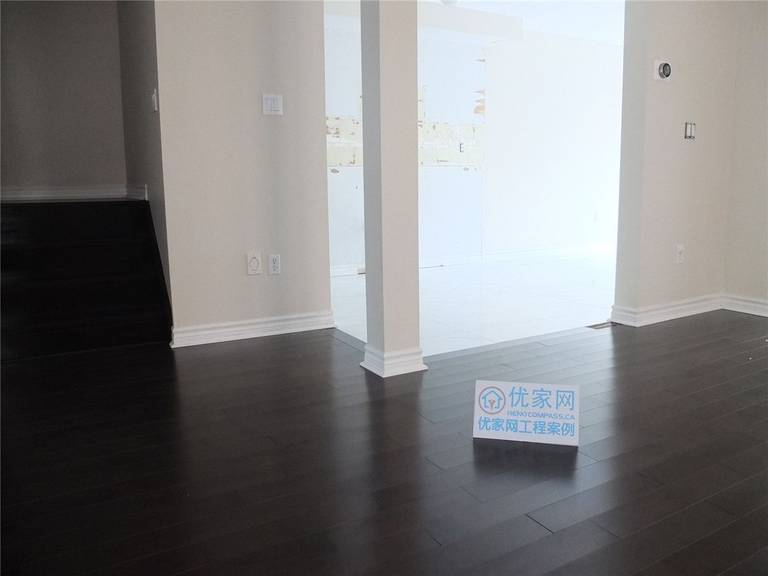 This image showcases the completed whole house flooring installation in Markham, featuring dark hardwood flooring with a clean, seamless finish. The newly installed floors enhance the home’s modern interior, creating a cohesive and elegant look across the main living area. This project reflects professional craftsmanship, precise installation, and high-quality flooring materials suitable for residential renovation projects in the Greater Toronto Area.