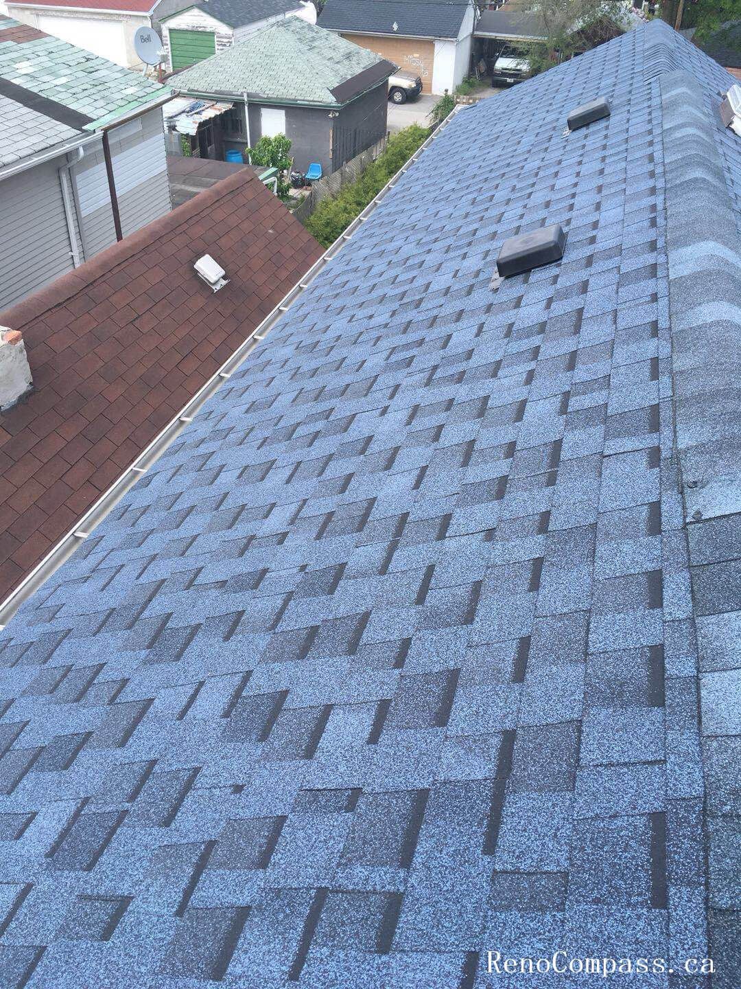 This image features the completed result of a residential roof replacement project in Toronto, showcasing newly installed asphalt shingles with a clean and uniform finish. The upgraded roofing system includes proper ventilation components and carefully aligned shingle placement to ensure long-term durability and protection against Toronto’s changing weather conditions. The project focuses on improving structural reliability, waterproof performance, and overall exterior appearance. Installed by a professional Toronto roofing and renovation team, the new roof enhances curb appeal while providing dependable, energy-efficient protection for the home throughout all seasons.