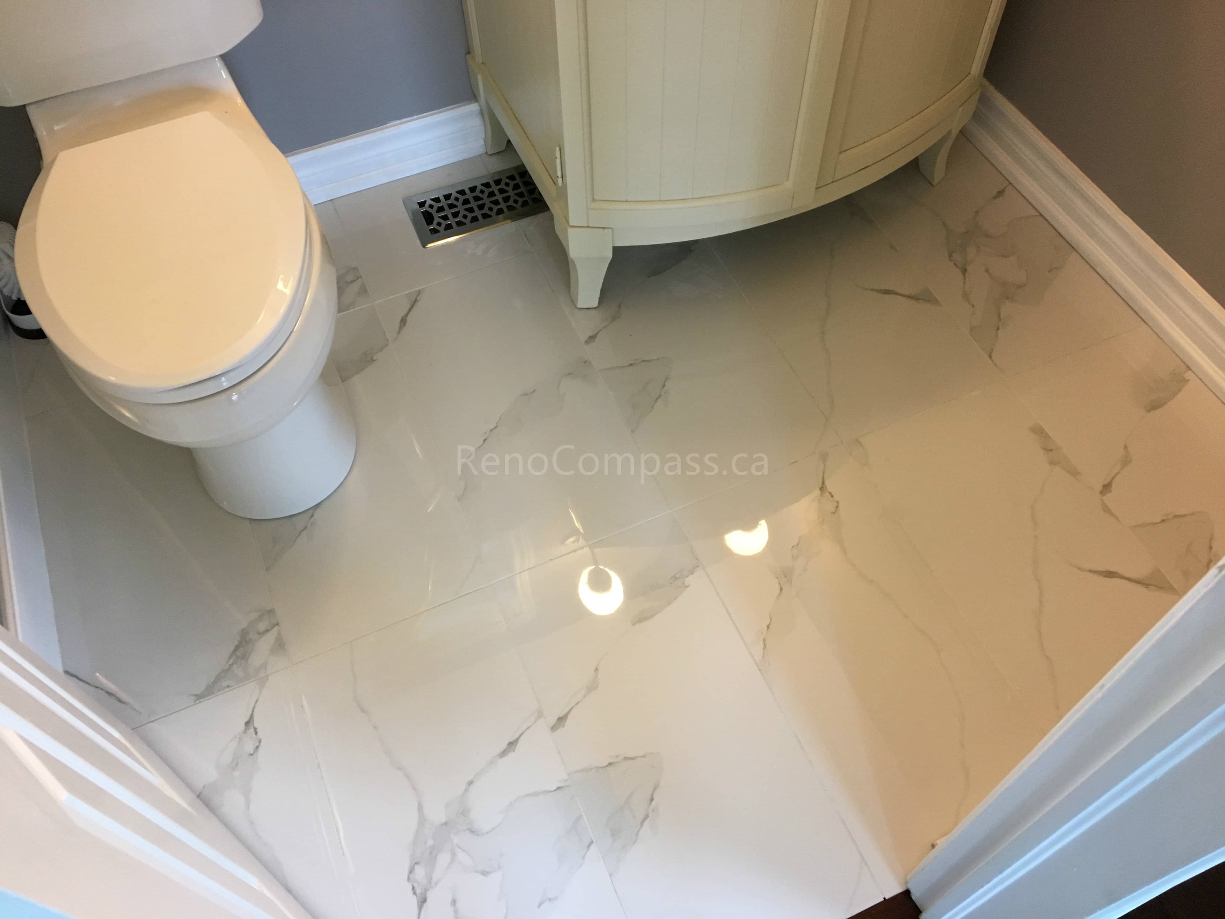 This Mississauga bathroom renovation features marble-look porcelain floor tiles, upgraded baseboards, and a refreshed vanity area for a clean and elegant finish. Completed by a professional Toronto renovation company, the project improves durability, moisture resistance, and overall bathroom aesthetics while creating a bright, polished, and easy-to-maintain space for everyday use.