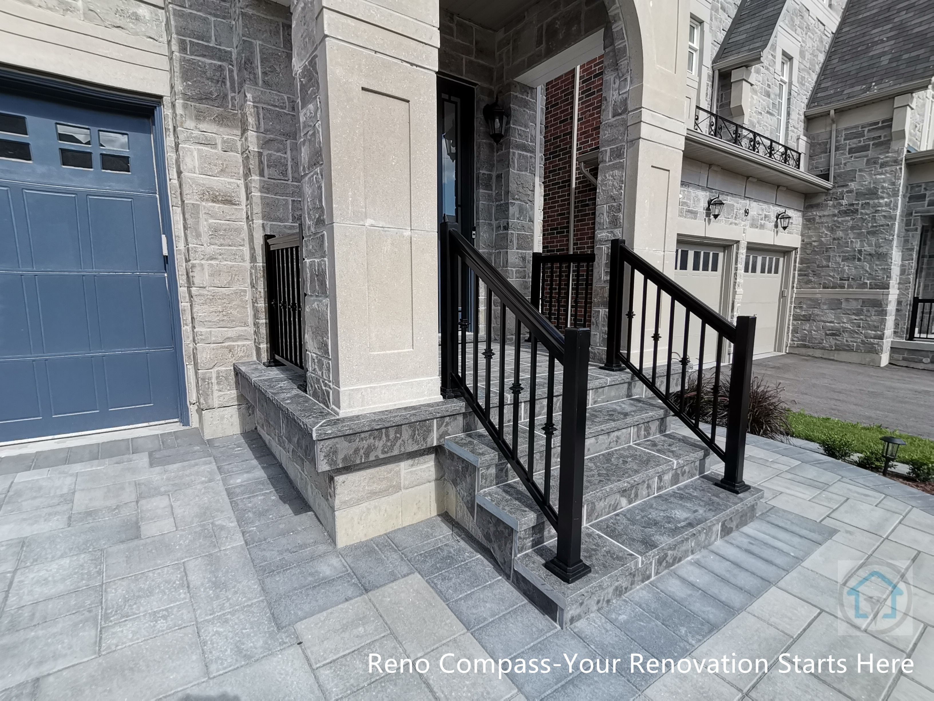 This Vaughan front entrance renovation highlights custom stone steps and a structured walkway leading to the main door. The natural stone finish, clean joint lines, and black metal railings create a refined and durable entry experience that seamlessly connects the driveway with the home’s front façade.