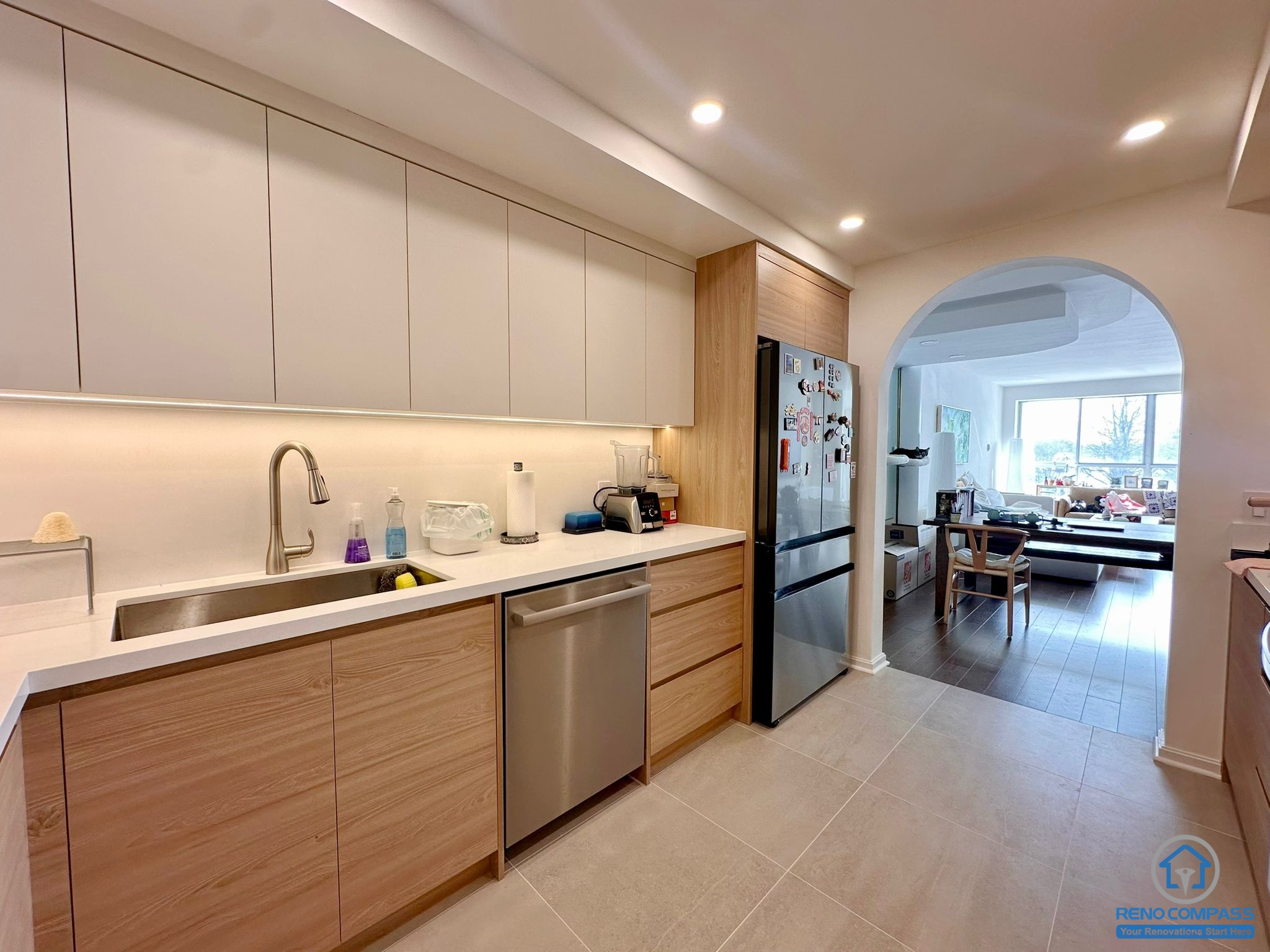 A spacious and bright condo kitchen in Toronto upgraded with modern pot lights and a functional open layout. The recessed lighting improves visibility and ambiance, making the entire space feel larger, cleaner, and more comfortable for everyday living.