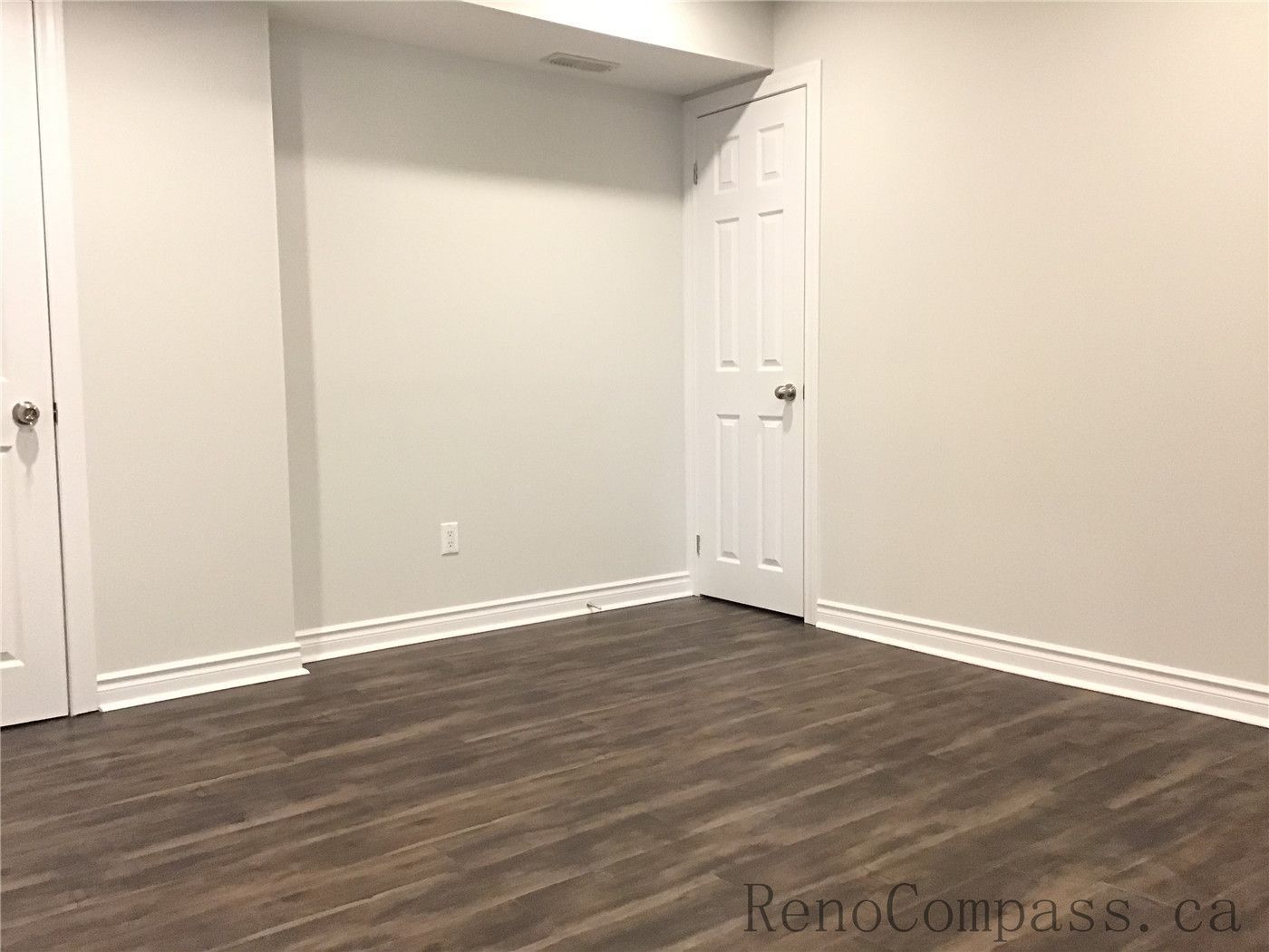 This Whitby basement renovation includes the installation of durable wood-look vinyl plank flooring, adding warmth and texture to the finished space. The rich brown tones and natural grain patterns create a cozy atmosphere while offering moisture resistance and long-lasting performance — an ideal flooring choice for modern basement living areas or bedrooms.

If there are more images for this Whitby Basement Renovation project, send them over and I’ll complete the full SEO set for you.