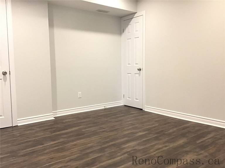 This Whitby basement renovation includes the installation of durable wood-look vinyl plank flooring, adding warmth and texture to the finished space. The rich brown tones and natural grain patterns create a cozy atmosphere while offering moisture resistance and long-lasting performance — an ideal flooring choice for modern basement living areas or bedrooms.

If there are more images for this Whitby Basement Renovation project, send them over and I’ll complete the full SEO set for you.