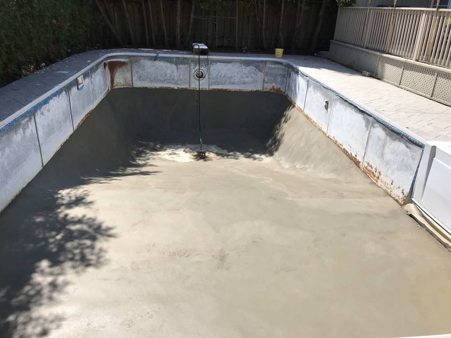 Custom backyard swimming pool construction in Toronto featuring professional steel pool structure installation and foundation preparation. This stage highlights precise pool framing, base leveling, and site grading to ensure long-term durability and structural stability for a high-quality residential swimming pool project.
