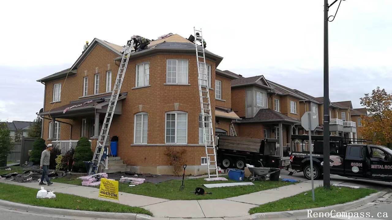 This image shows an active roof replacement project at a residential property in Markham, capturing the full scope of professional roofing work in progress. The project includes complete removal of the existing roofing system, material staging, and preparation for new roof installation. Multiple access ladders, safety setup, and organized debris management reflect a structured and efficient construction process. The roofing upgrade focuses on improving weather resistance, structural protection, and long-term durability while maintaining the home’s original architectural style. Completed by an experienced renovation and roofing team, this Markham roof replacement project enhances both functional performance and overall exterior curb appeal for long-term residential value.