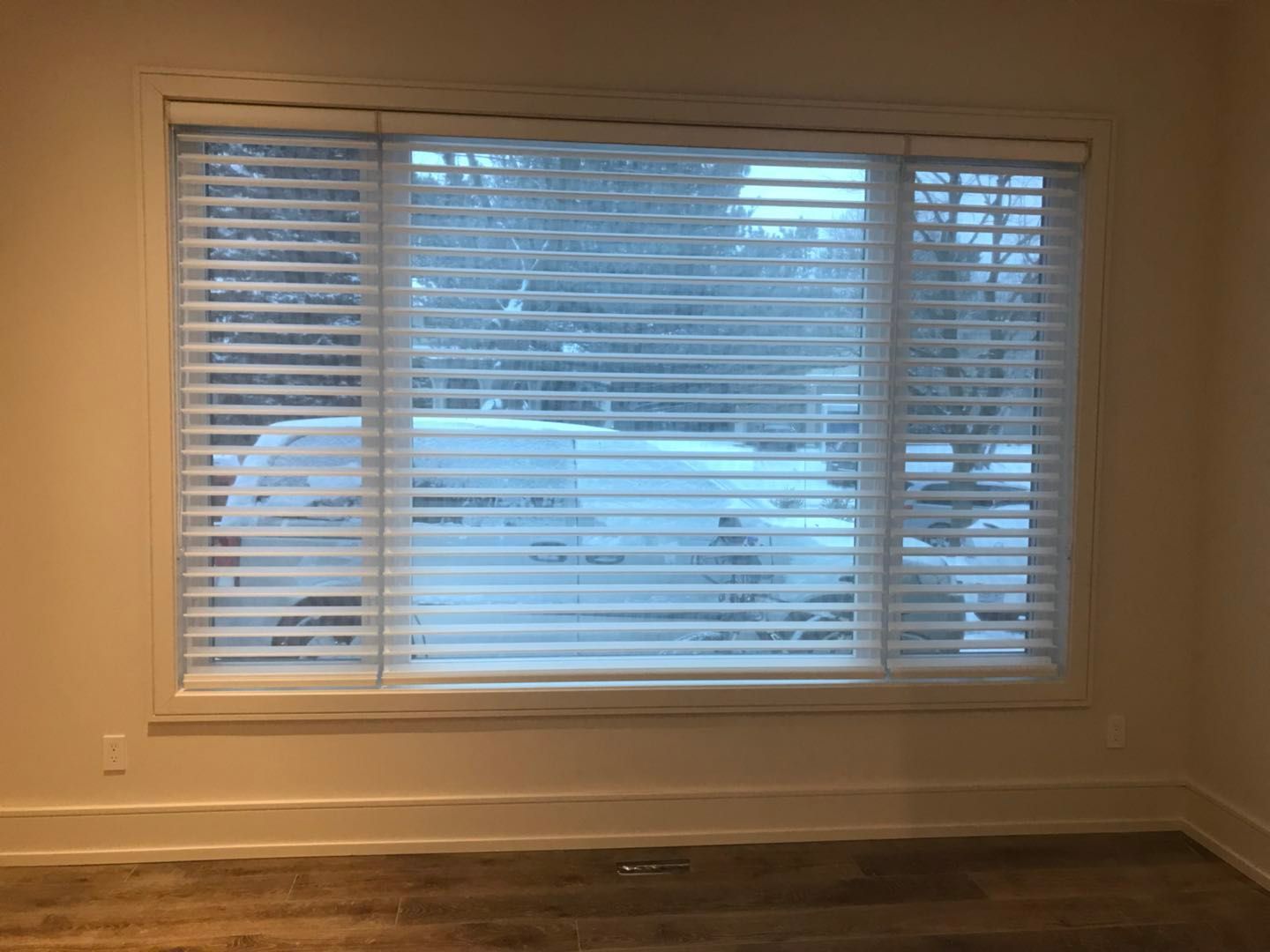 Custom zebra blinds installation in Toronto dining room by professional Toronto renovation company Reno Compass Inc. Featuring dual-layer light filtering shades, clean white window trim, modern chandelier lighting, and elegant wall panel detailing. This window treatment upgrade enhances privacy, natural light control, and interior aesthetics with a sleek and contemporary finish.