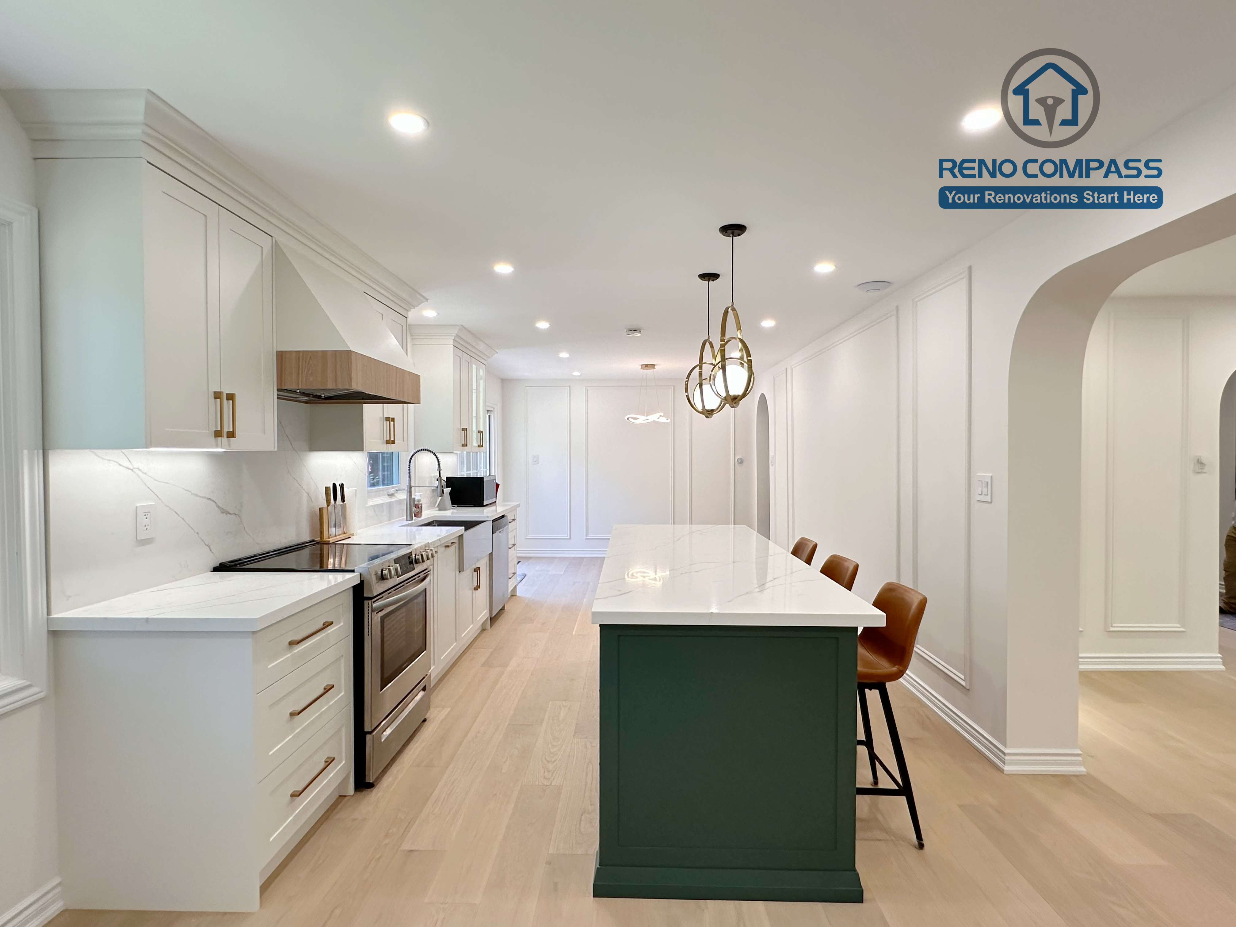 This Markham kitchen renovation highlights a spacious central island with seating, paired with a well-organized cooking area featuring quartz countertops, custom cabinetry, and stainless steel appliances. Pendant lighting and recessed ceiling lights provide balanced illumination, while wide-plank hardwood flooring enhances continuity throughout the space. Completed by a professional Toronto renovation company, Reno Compass Inc., the kitchen is designed for efficiency, comfort, and everyday use.