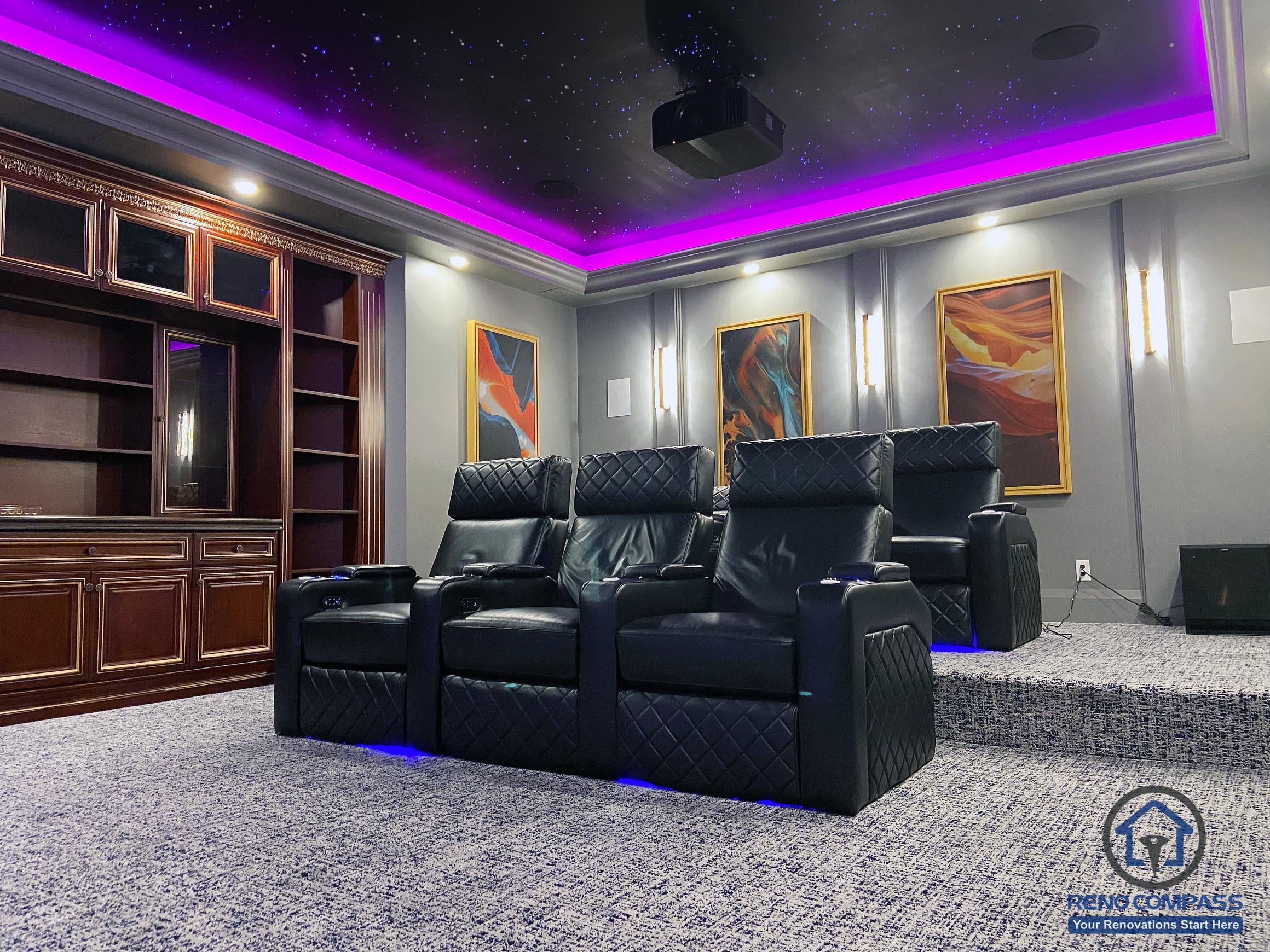 Full view of a custom home theatre renovation in Aurora featuring tiered seating, star ceiling, ambient LED lighting, and a large projection screen for immersive entertainment.