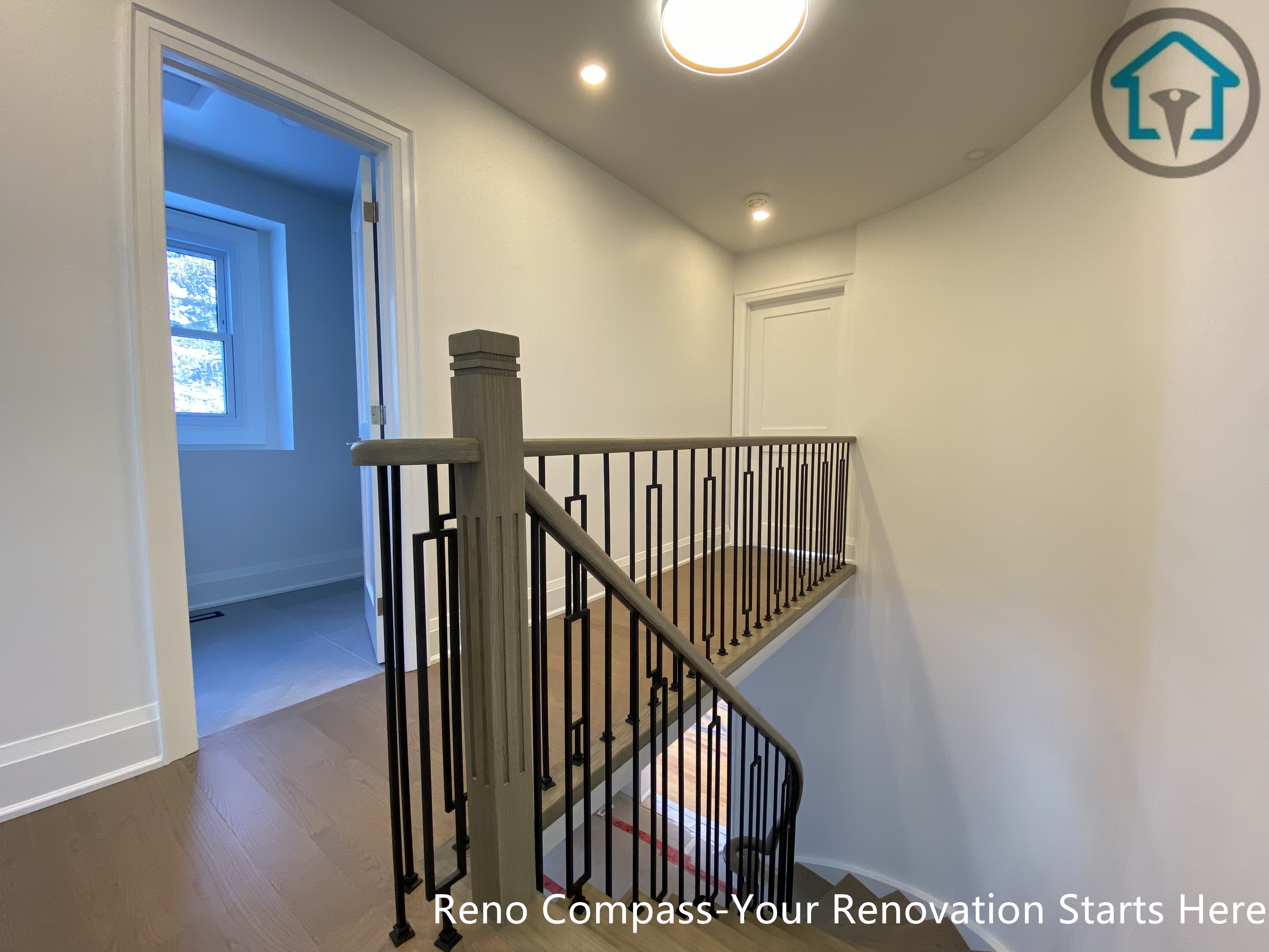 An overall view of the hardwood flooring and staircase renovation in Markham, completed by Toronto Renovation Company Reno Compass Inc. The coordinated materials and clean lines create a cohesive, modern interior suitable for long-term residential living.