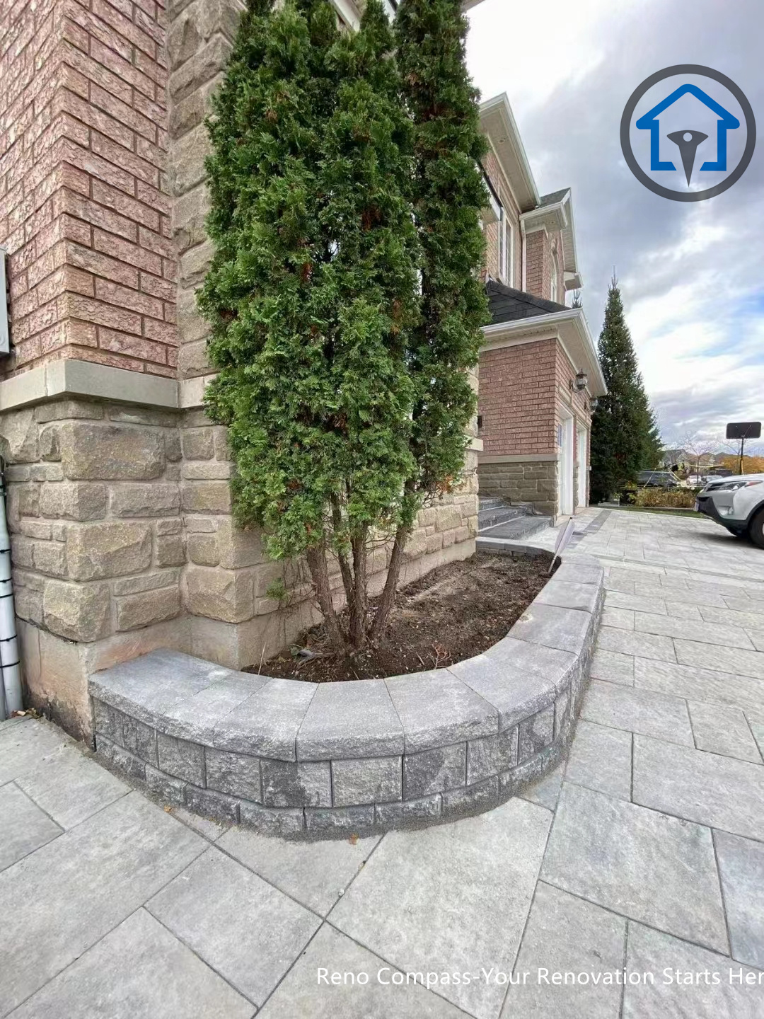 This image features a front entrance patio paving project in Oakville, combining interlocking stones with a practical layout that improves accessibility and outdoor usability. The design complements the home’s architecture and enhances curb appeal. Completed by Reno Compass Inc.